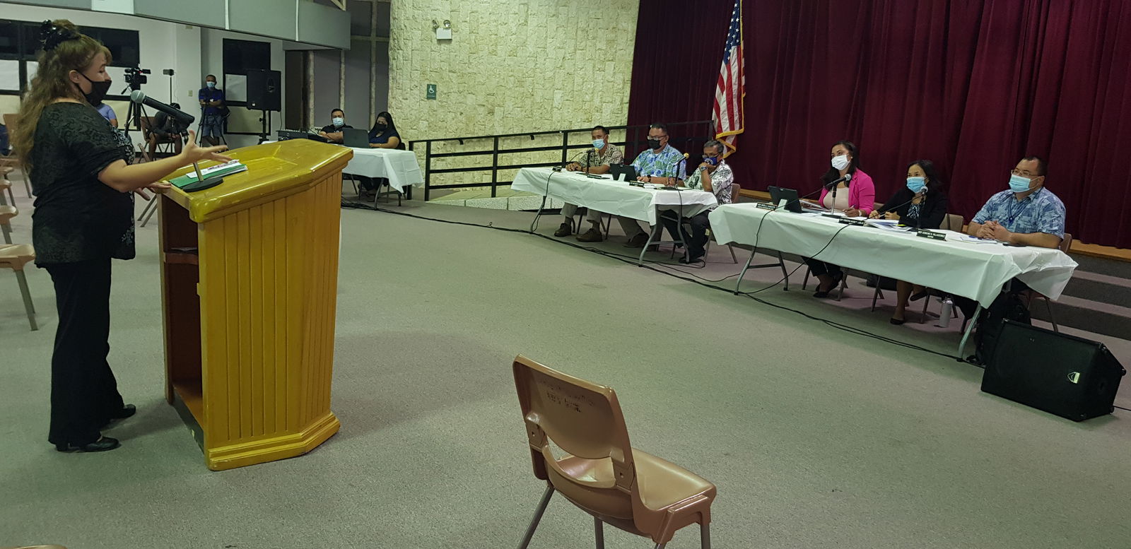Members of the House minority bloc listen to a community member  during a town hall at the multi-purpose center on Wednesday.