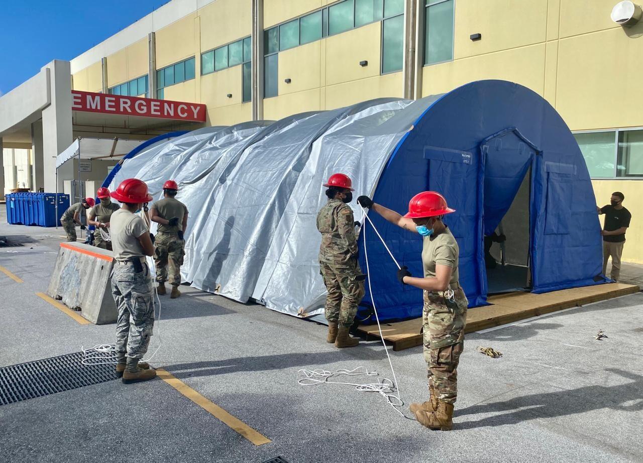 Members of the Guam National Guard's Task Force Engineer and Surgeon Cell install the first of two BLU-MED tents outside the Guam Regional Medical City emergency room in Dededo on Nov. 2, 2020.Photo courtesy of the Guam National Guard/ The Guam Daily Post