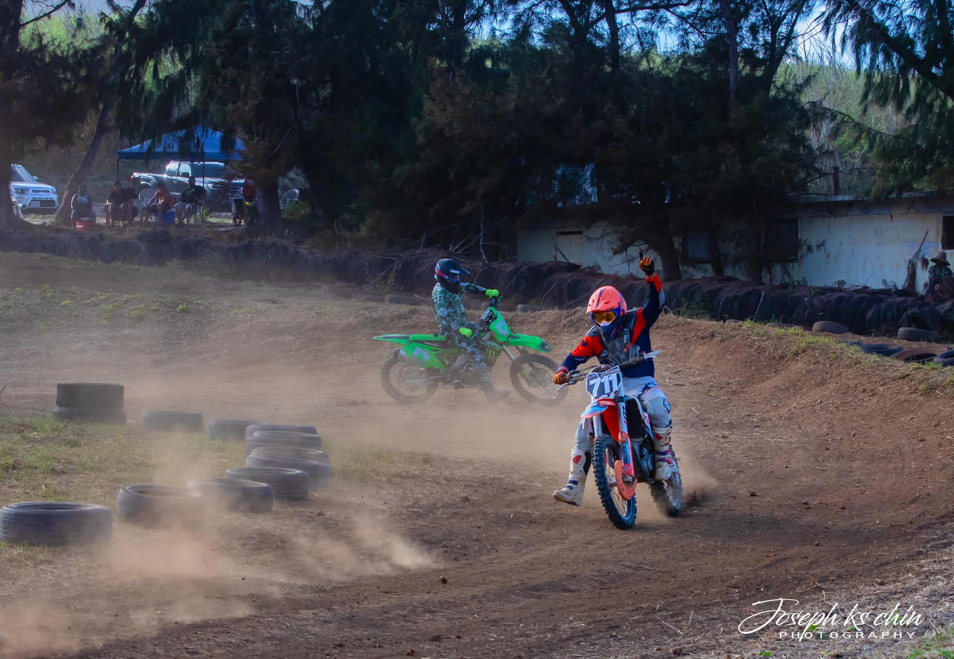 Cuki Alvarez gestures after passing his son Shane Alvarez for first place during an MRA race at the Cow Town track.Photo by  Joseph Chin