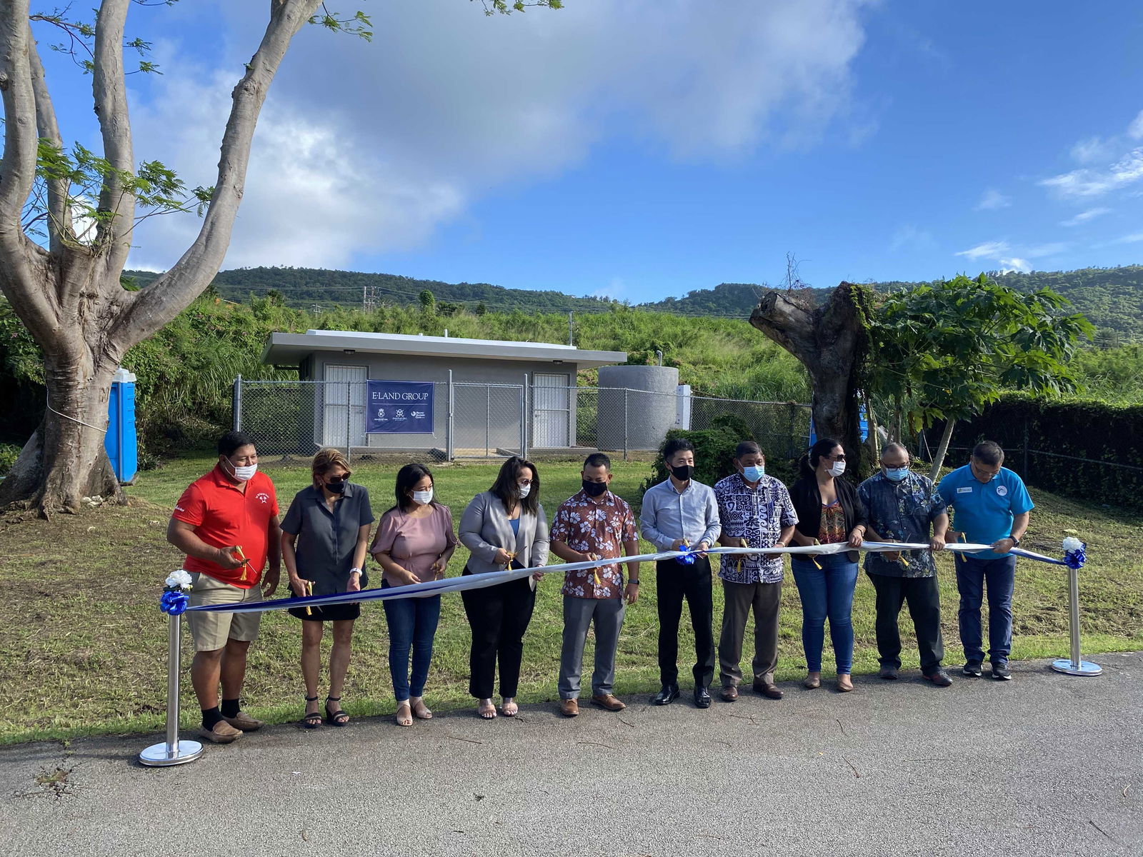 Micronesia Resort chief executive officer Brian Shin, sixth from left, joins hotel and CNMI government officials at the ribbon cutting for the newly renovated Paupau Beach restrooms on Friday afternoon.