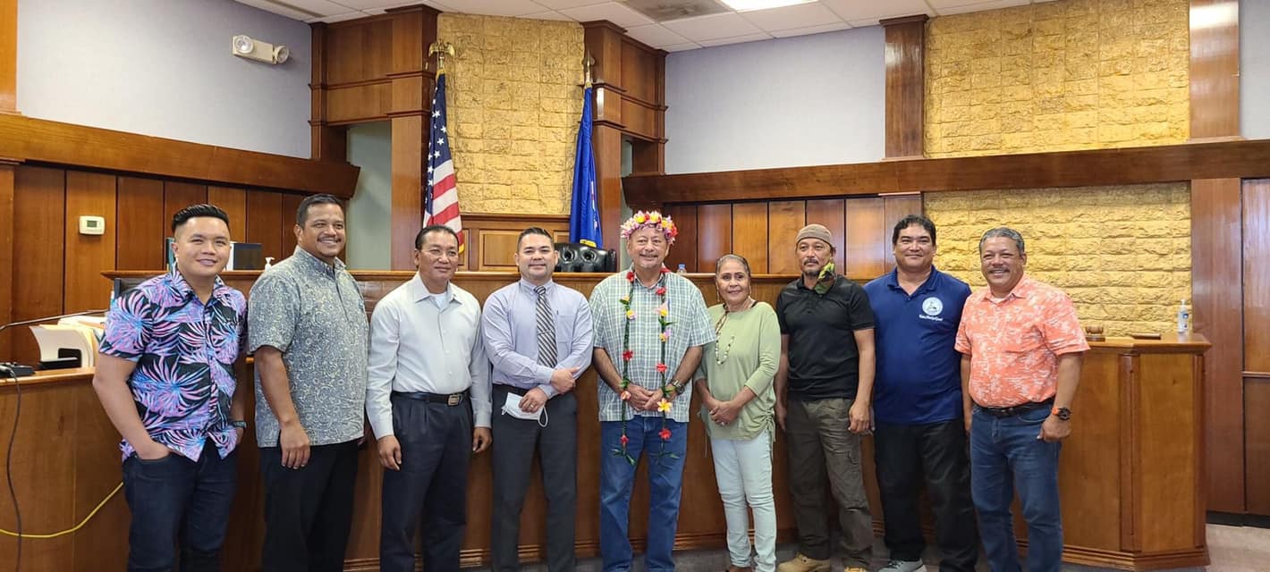 Department of Community and Cultural Affairs Secretary Joseph P. Deleon Guerrero, center, with senators, family members, Tinian Mayor Edwin Aldan, right, and Press Secretary Kevin Bautista following a  public hearing at the Tinian Court House on Dec. 2, 2020.Office of the Governor photo