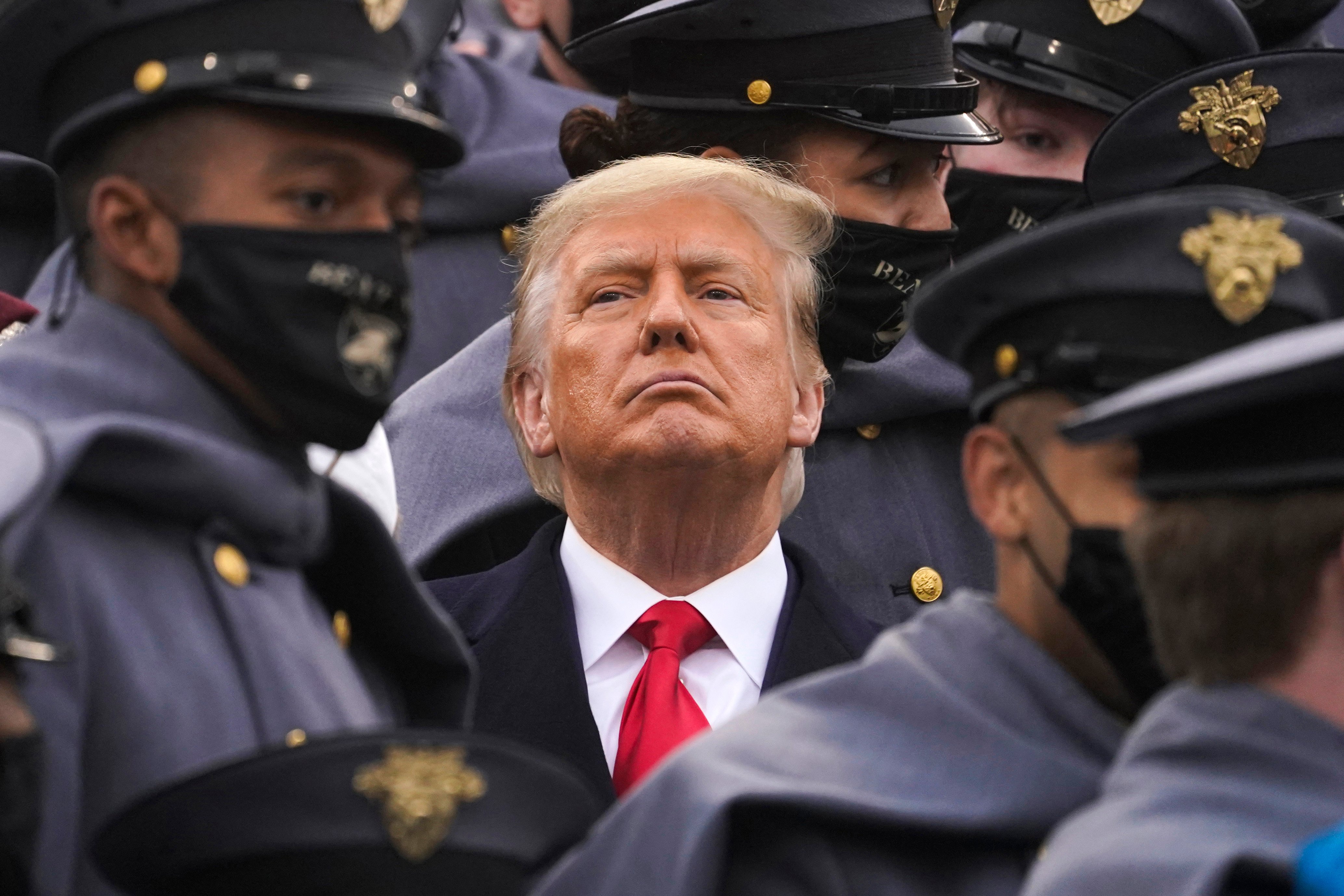 Surrounded by Army cadets, President Donald Trump watches the first half of the 121st Army-Navy Football Game in Michie Stadium at the United States Military Academy, Saturday, in West Point, N.Y.AP