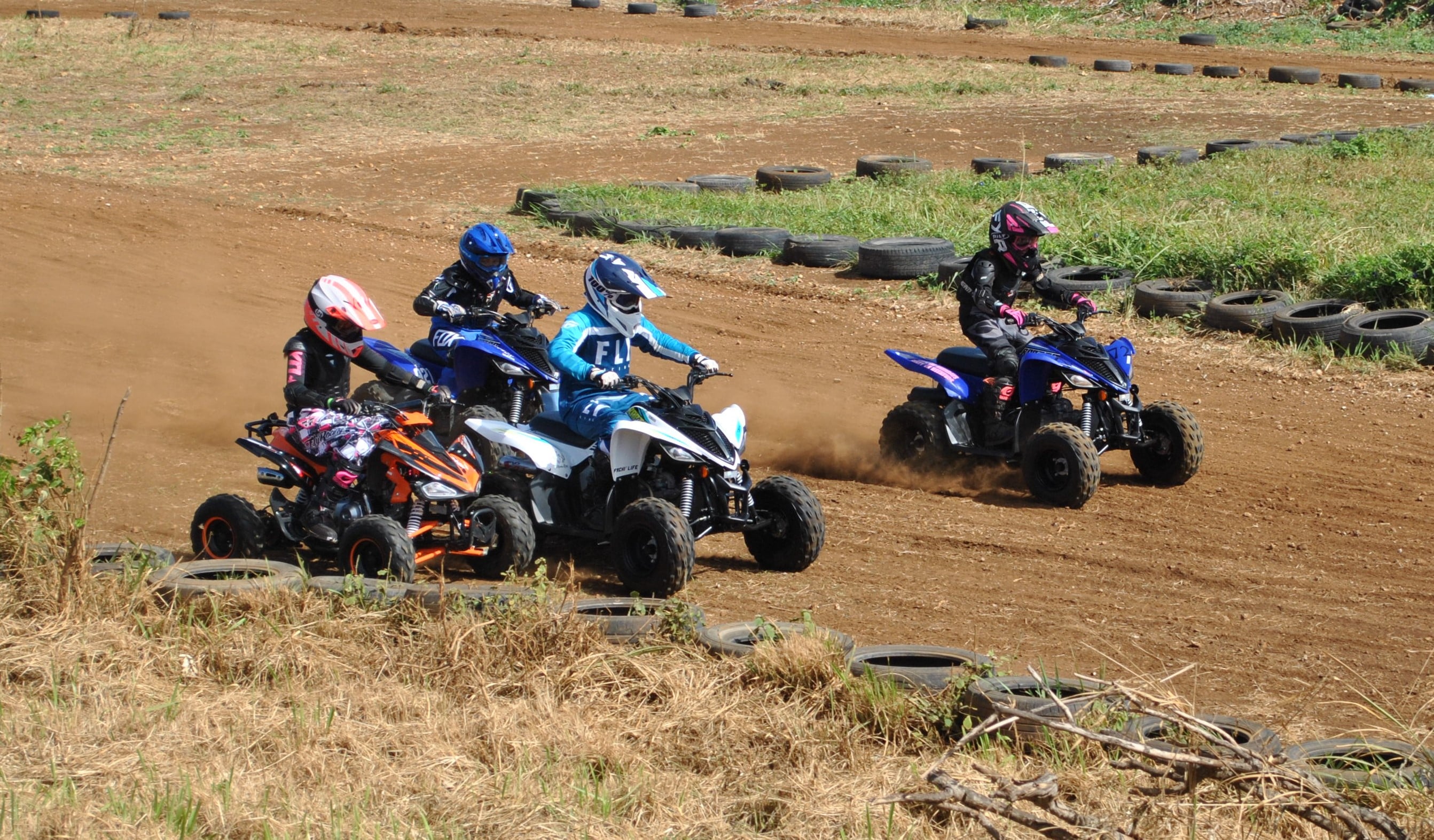 The riders of the Mini-ATV class push through during an MRA 2021 Points Race Season race at  Cow Town Raceway Park on Sunday.Photo by James F. Sablan Jr.