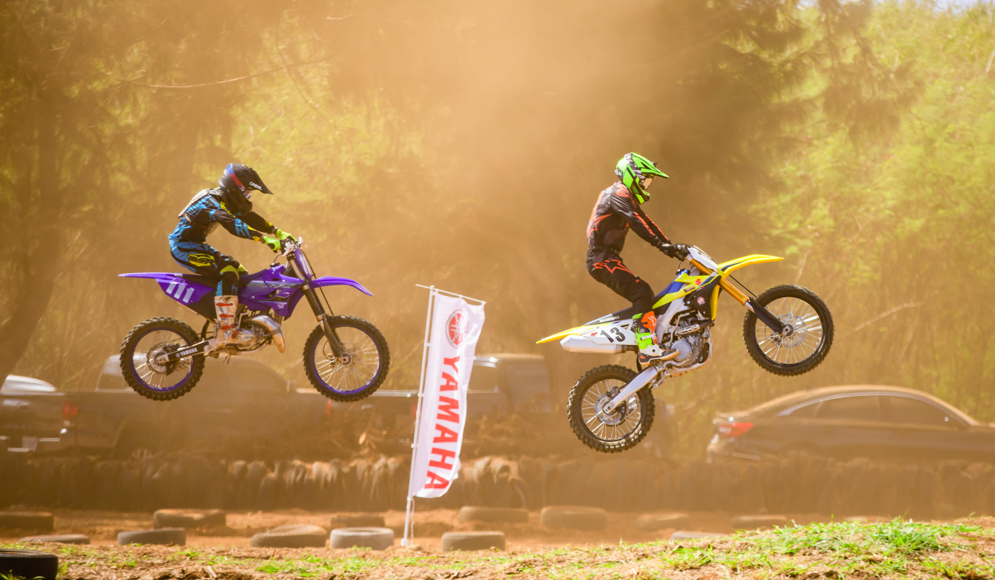 Cuki Alvarez, left, and Angelito Hernaez take air as they battle for first place in the expert class of the MRA 2021 Points Race Season at Cow Town Raceway Park on Sunday.Photo by Joseph Chin