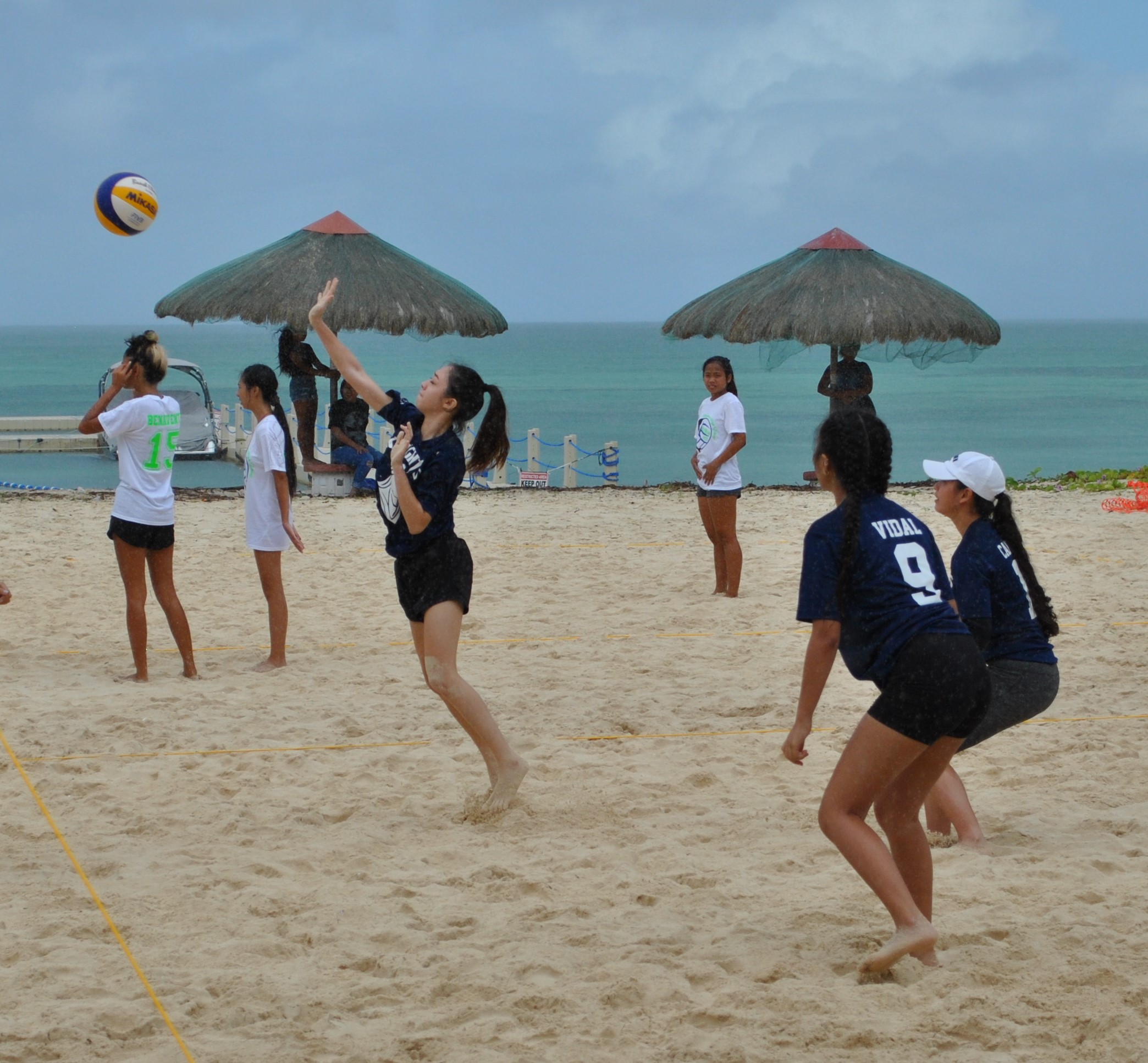 Mount Carmel School 1's Kaia Travilla attempts a spike return during a PSS 4v4 Beach Volleyball Tournament girls division game at the Fiesta Resort beach on Saturday.Photo by James F. Sablan Jr.