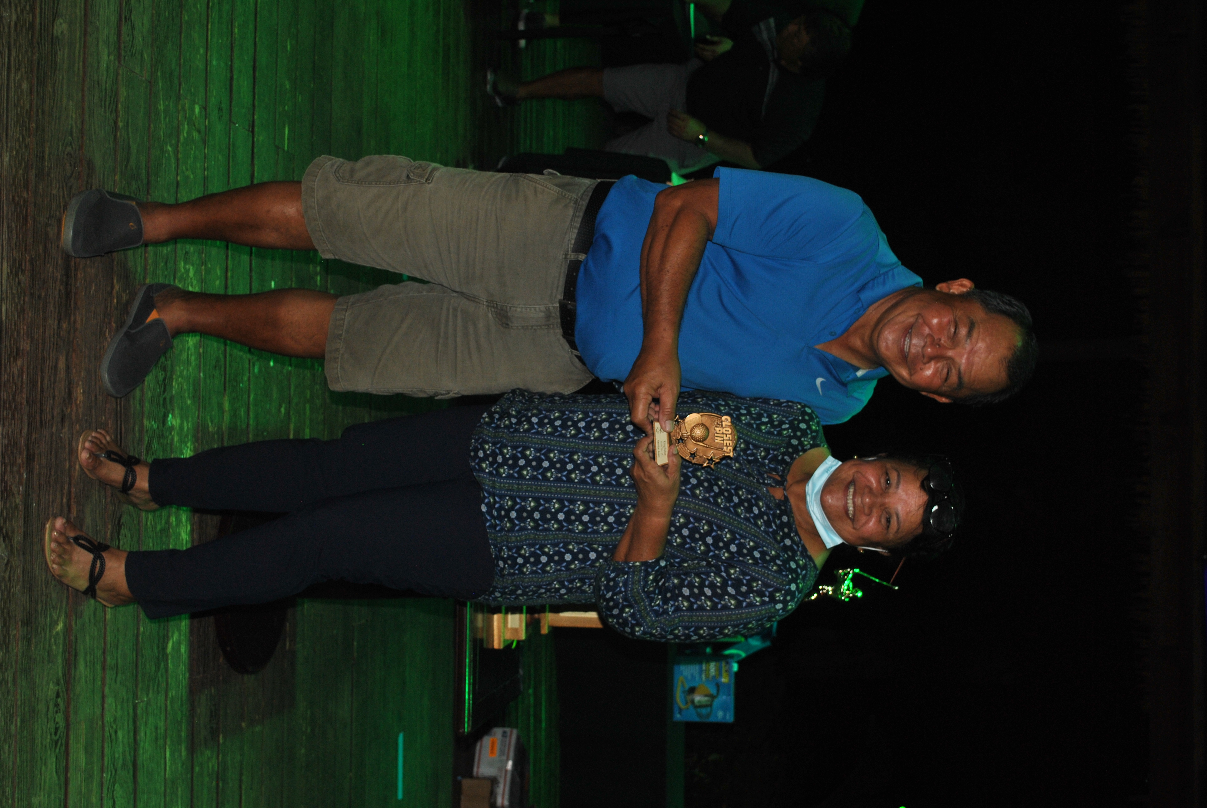 Sherlyn Jones, right, receives the Closest to the Fairway Flag Award from Amigos Golf Club president Joe Torres at the Fiesta Resort on Friday.Photo by James F. Sablan Jr.