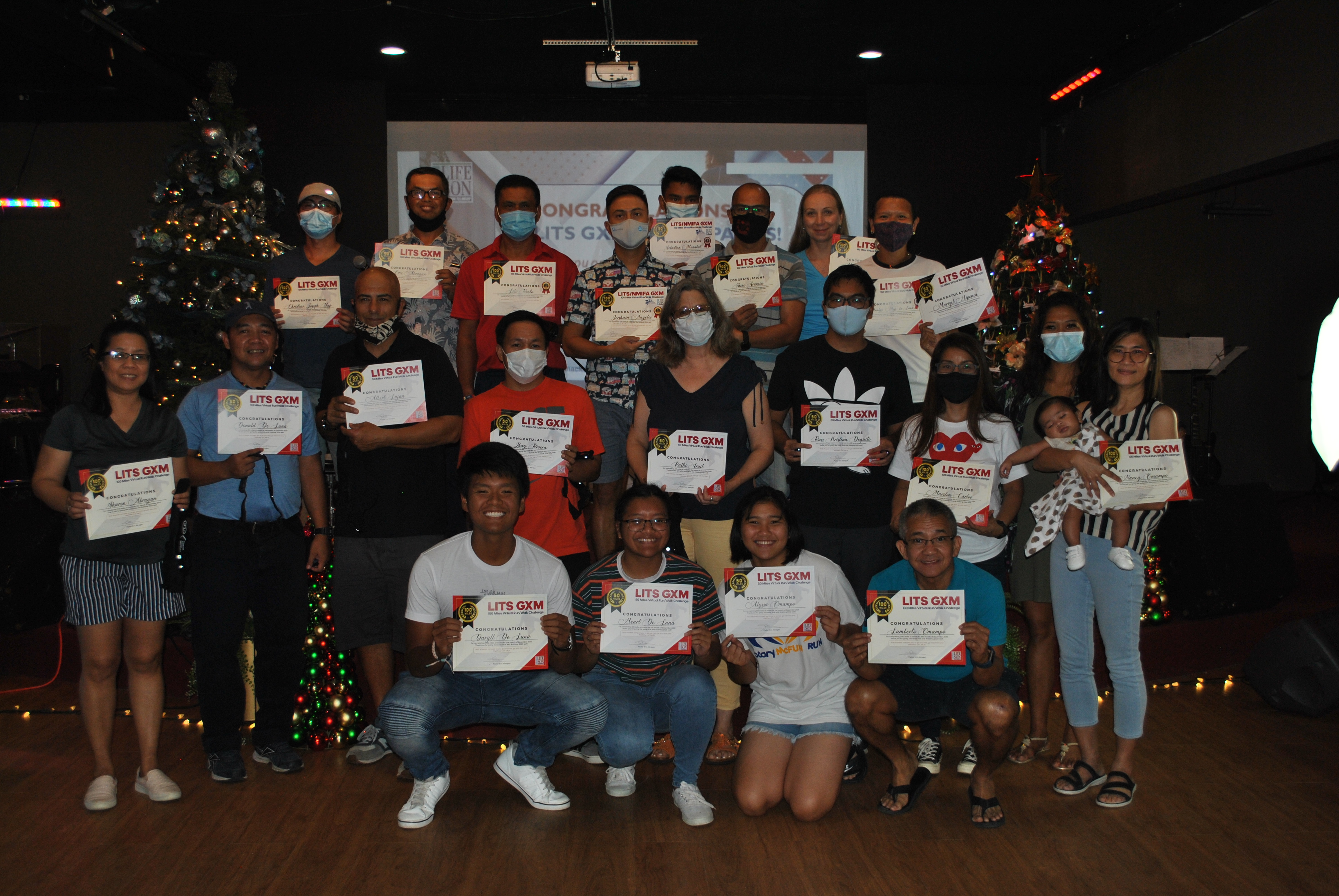 The top finishers of the Life in the Son-Go the Xtra Mile Walk/Run Virtual Challenge pose for a photo during Sunday's award ceremony at the Life in the Son Church.Photo by James F. Sablan Jr.