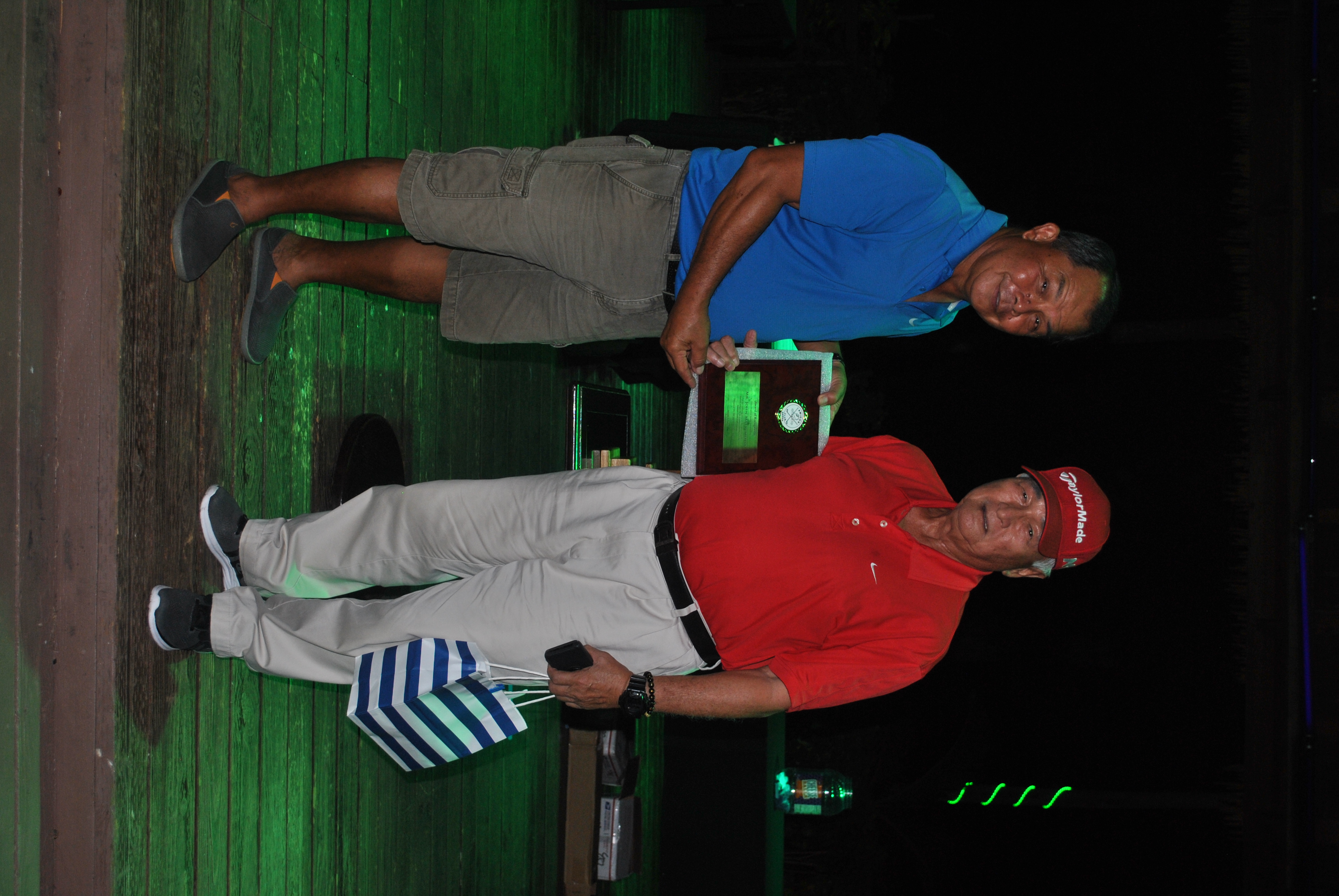 John Matsumoto, right, receives an Award of Recognition from Amigos Golf Club president Joe Torres at the Fiesta Resort on Friday.Photo by James F. Sablan Jr