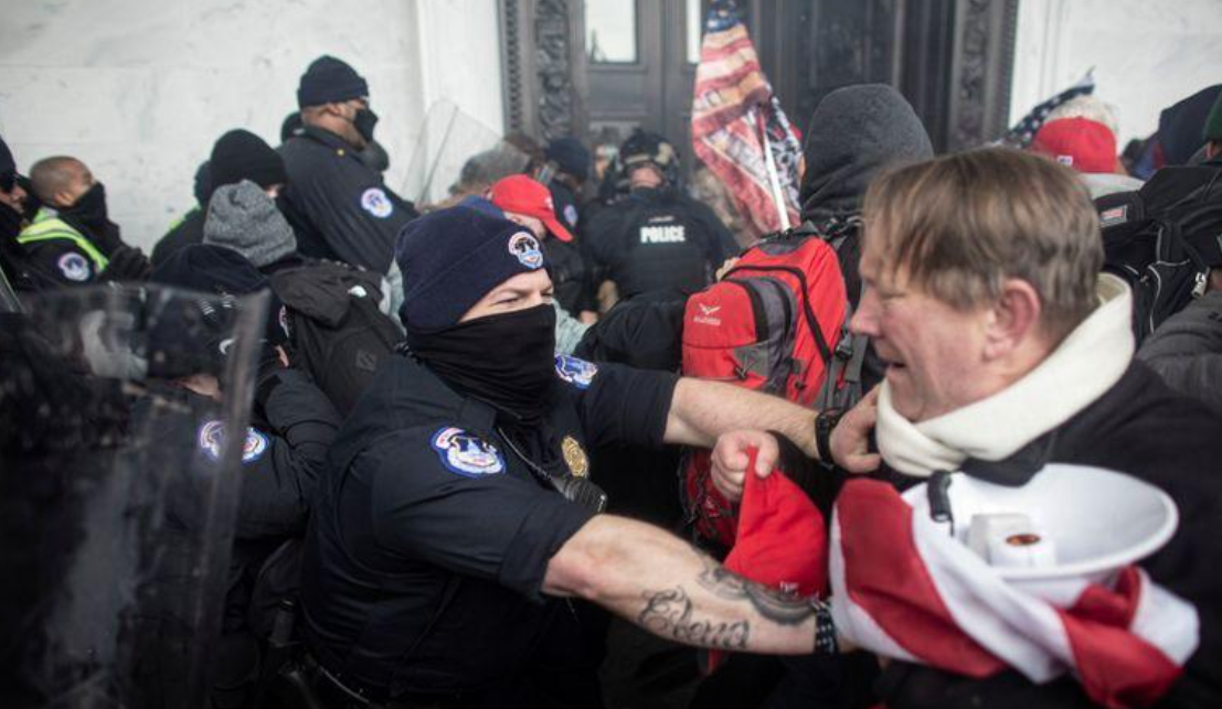 Members of law enforcement clash with pro-Trump protesters, who stormed the U.S. Capitol during a rally to contest the certification of the 2020 presidential election results by Congress in Washington, D.C. on Wednesday.REUTERS
