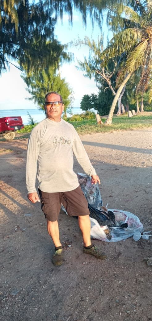 Max Aguon points to the animal entrails  dumped at Pakpak Beach on Sunday.Contributed photo