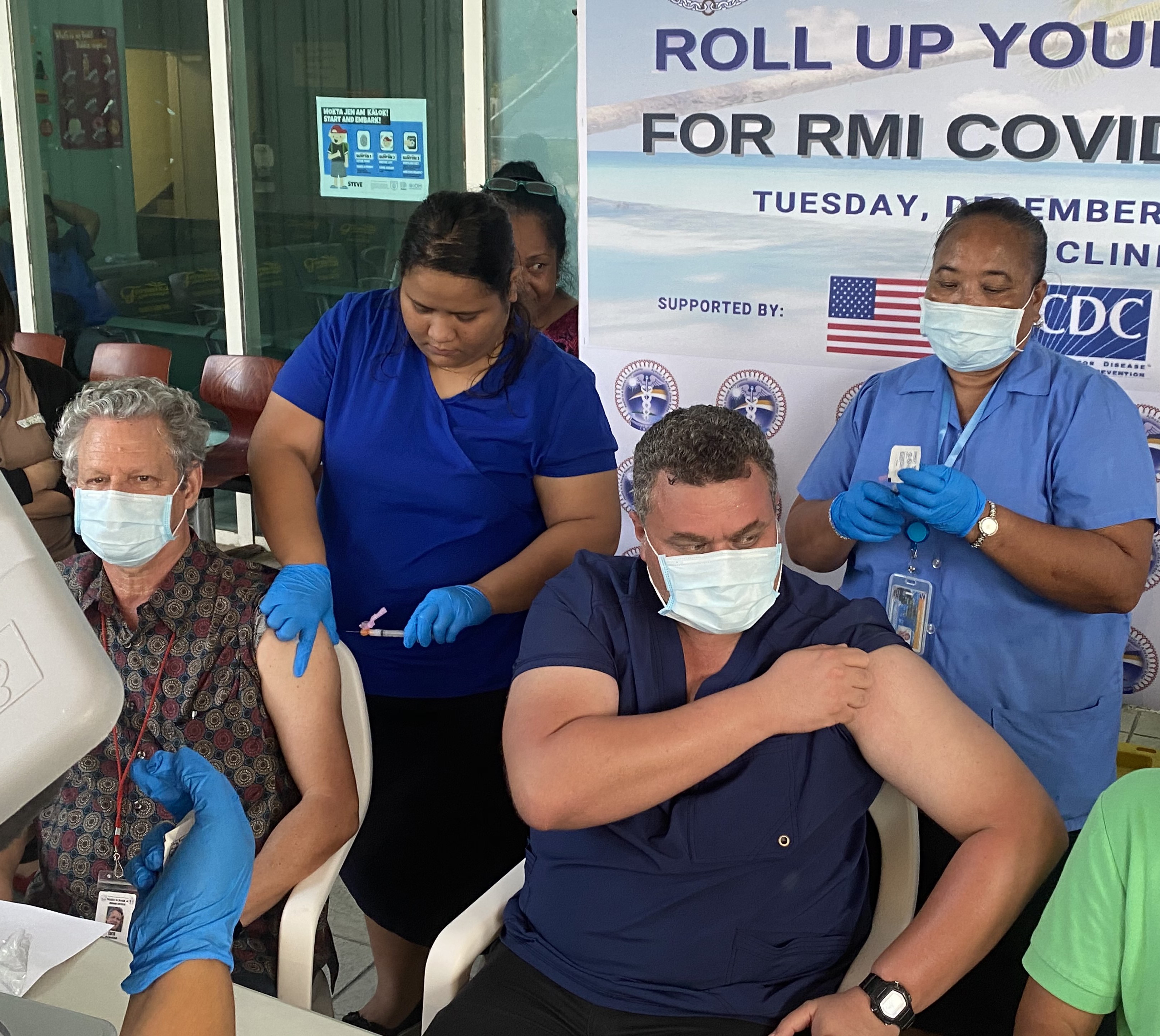 Marshall Islands Health Secretary Jack Niedenthal, left, and Public Health Director Dr. Frank Underwood received Covid vaccines in Majuro recently from public health nurses Mineko Mista and Rosabella Jennet.Photo by Giff Johnson