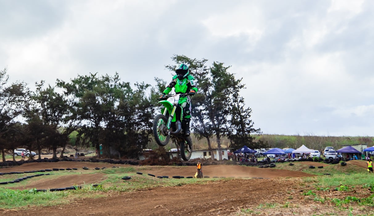 MJ Camacho executes a jump during a Mini I and II practice race at the Cow Town track.Photo by Joseph Chin