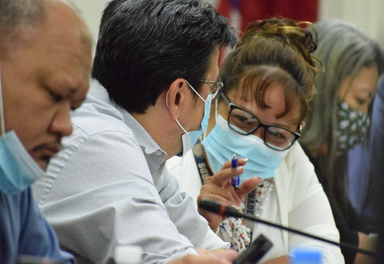 Rep. Celina Babauta talks with Rep. Edwin Propst during the Saipan and Northern Islands Legislative Delegation’s organizational session on Wednesday.Photo by Emmanuel T. Erediano