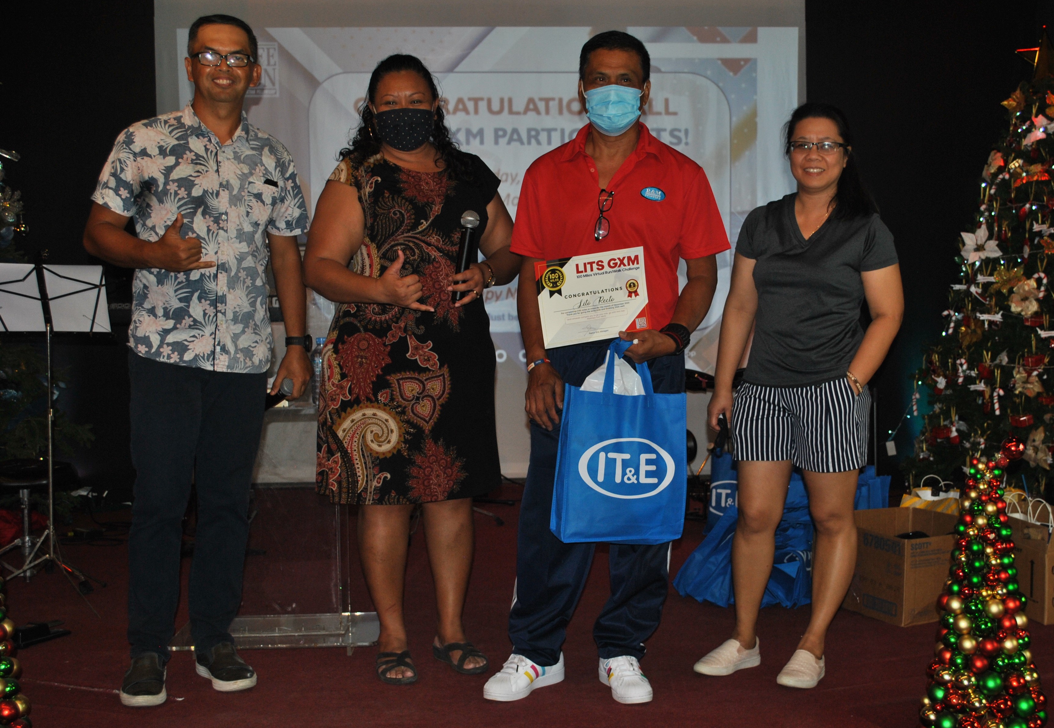 Lito Recto, third left, with Pastor Eric Abragan, Cherlyn Cabrera-Osung and Sharon Abragan during  Sunday's award ceremony at the Life in the Son Church.Photo by James F. Sablan Jr.