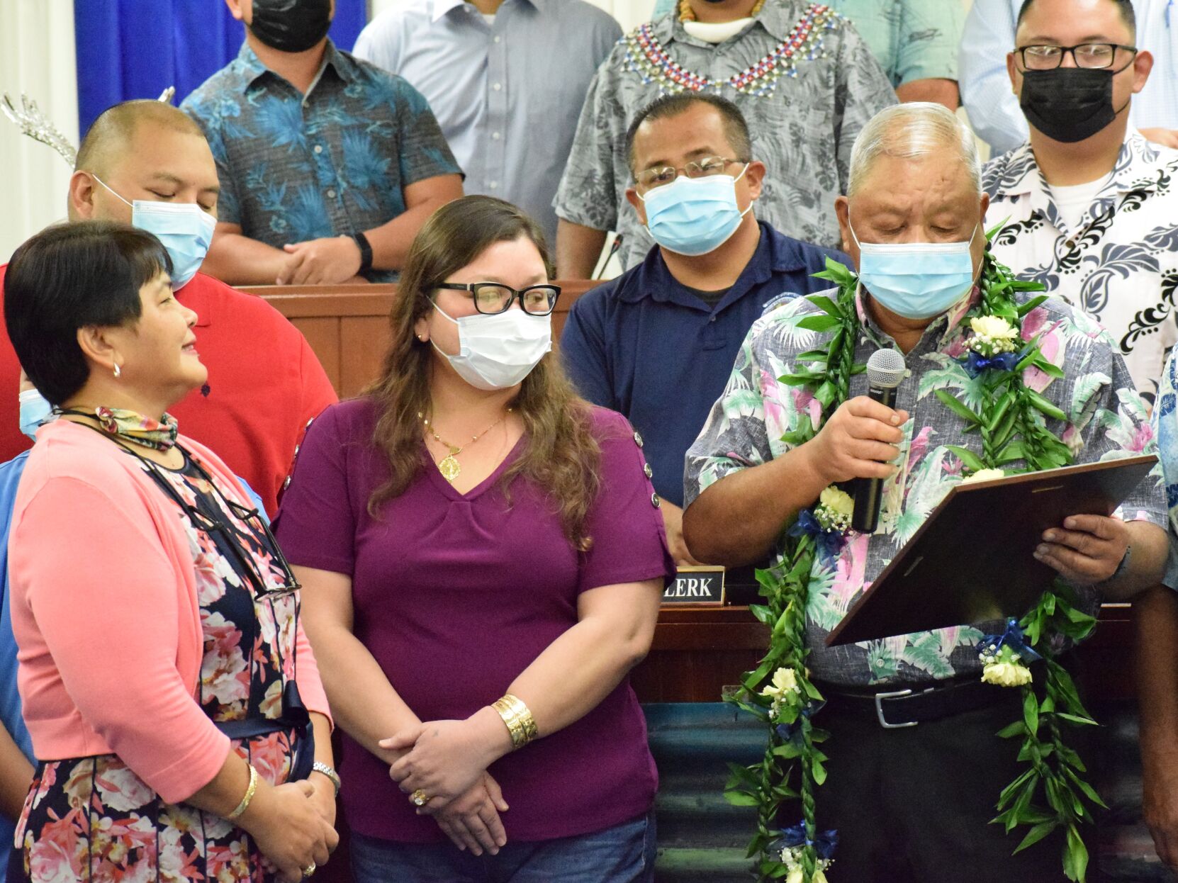 Saipan Mayor David M. Apatang, right, looks at the framed  copy of a House resolution honoring him, as its author, Rep. Janet Maratita, left, looks on before the 21st House  adjourned for the last time on Wednesday.Photo by Emmanuel T. Erediano