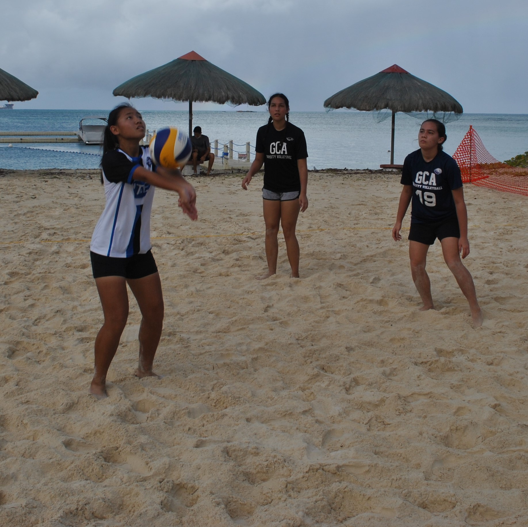 GCA 1's Clerisse Dacumos connects the bump for the set up during a PSS 4v4 Beach Volleyball League girls division game at the Fiesta Resort beach on Saturday.Photo by James F. Sablan Jr.