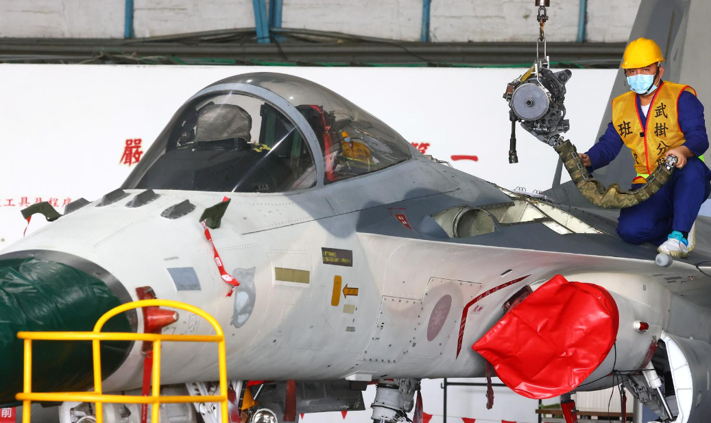 Mechanics repair an F-CK-1 Ching-kuo Indigenous Defense Fighter at an Air Force base in Tainan, Taiwan on Jan. 26, 2021.REUTERS