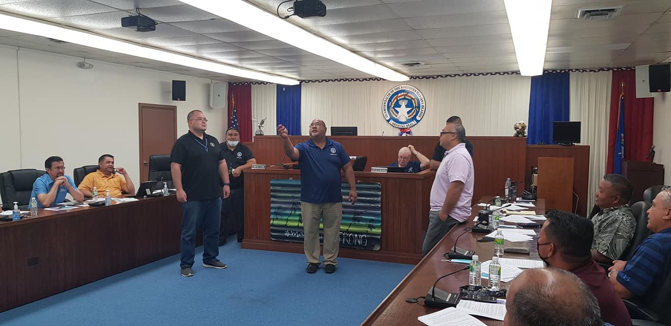 House legal counsel Joe Taijeron tosses the coin as Rep. Edmund Villagomez and Speaker Blas Jonathan Attao look on during the selection of a pro-tempore speaker and a pro-tempore floor leader on Friday. Also in photo are Rep.-elect Edwin Propst, Rep. Ralph Yumul, Legislative Bureau staff member Simeon Lisua, House legal counsel, John Cool, Rep.-elect Angel Demapan, Reps. Joe Flores and Joel Camacho. Contributed photo
