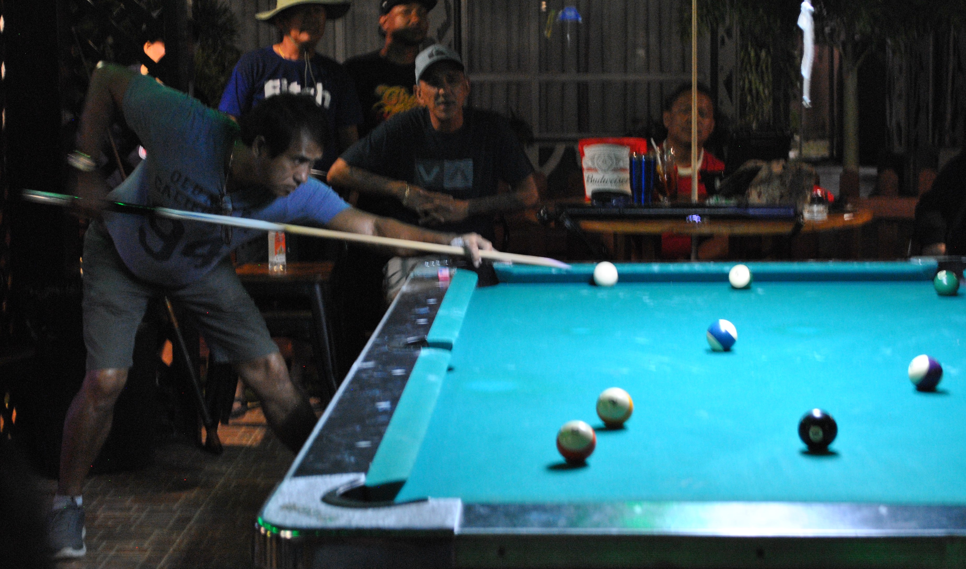 Rowel Mariano lines up for a shot during a pool tournament at the New Bamboo Bar of Saipan Vegas.Photo by James F. Sablan Jr.