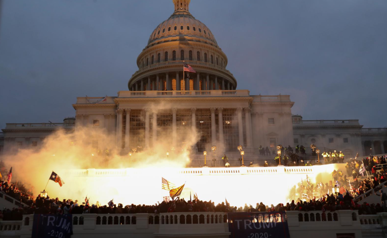 An explosion caused by a police munition is seen while supporters of President Donald Trump gather in front of the U.S. Capitol  in Washington, D.C. on Wednesday.REUTERS