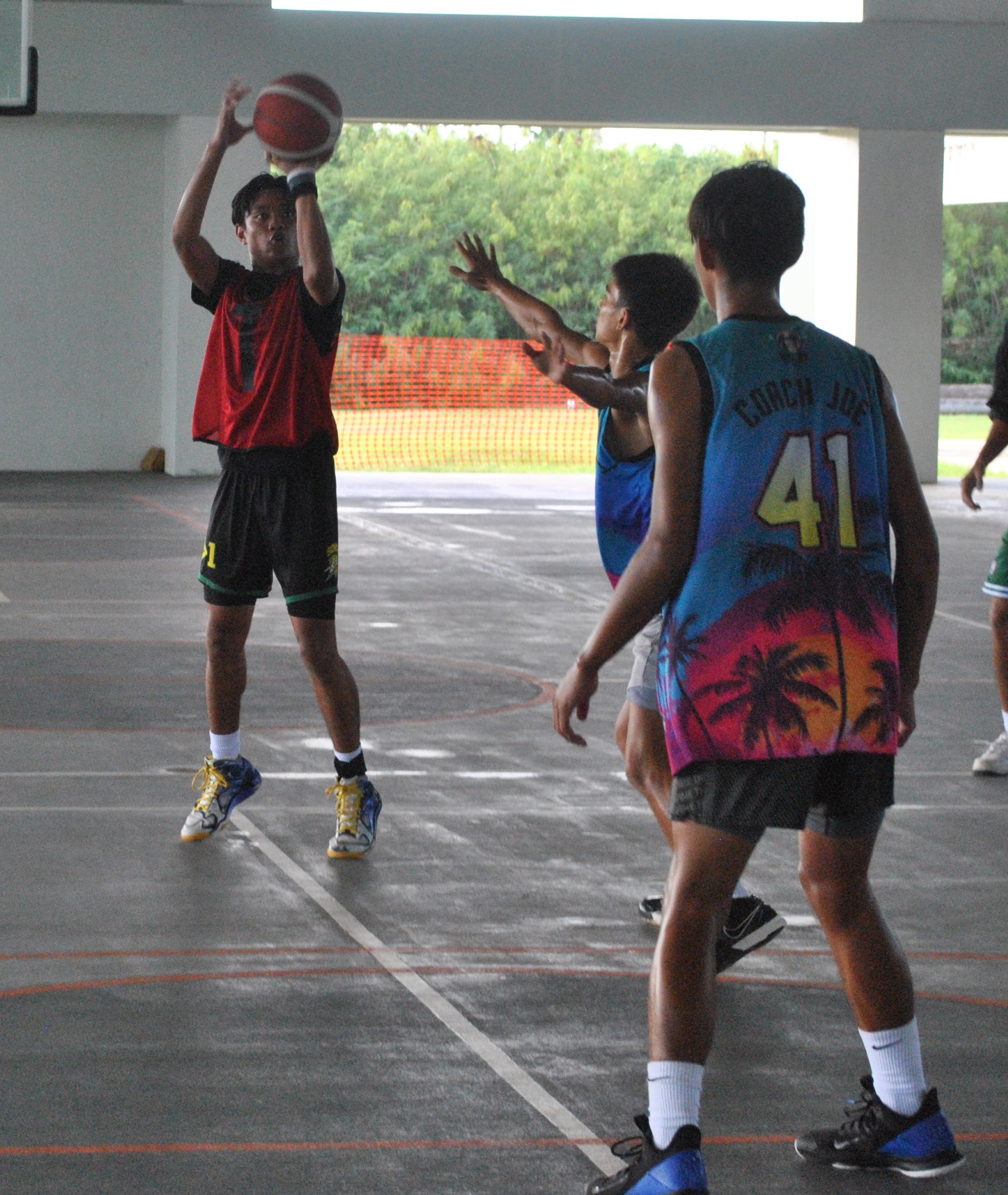 Sun Palace's Khristian Itaas takes the three-point shot.