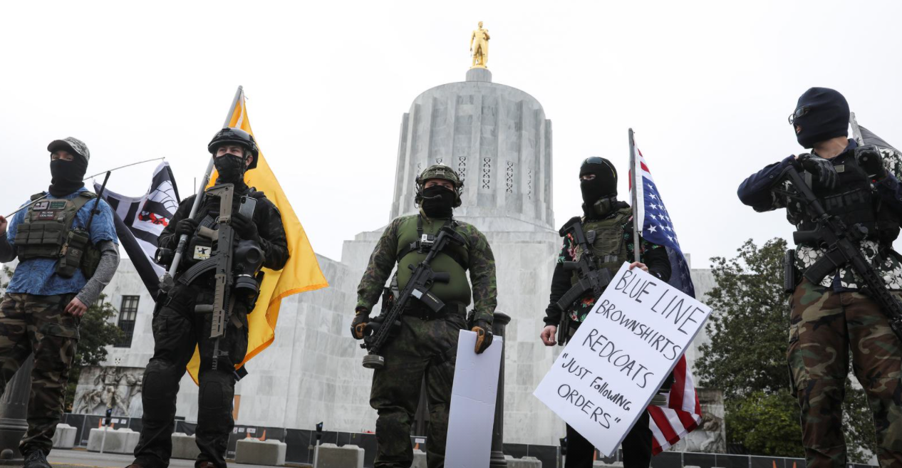 An armed group, who identify as "Liberty Boys" and the anti-government group "Boogaloo Bois" protest outside the Oregon State Capitol, as they advocate for less government control, in Salem, Oregon on Jan. 17, 2021.REUTERS