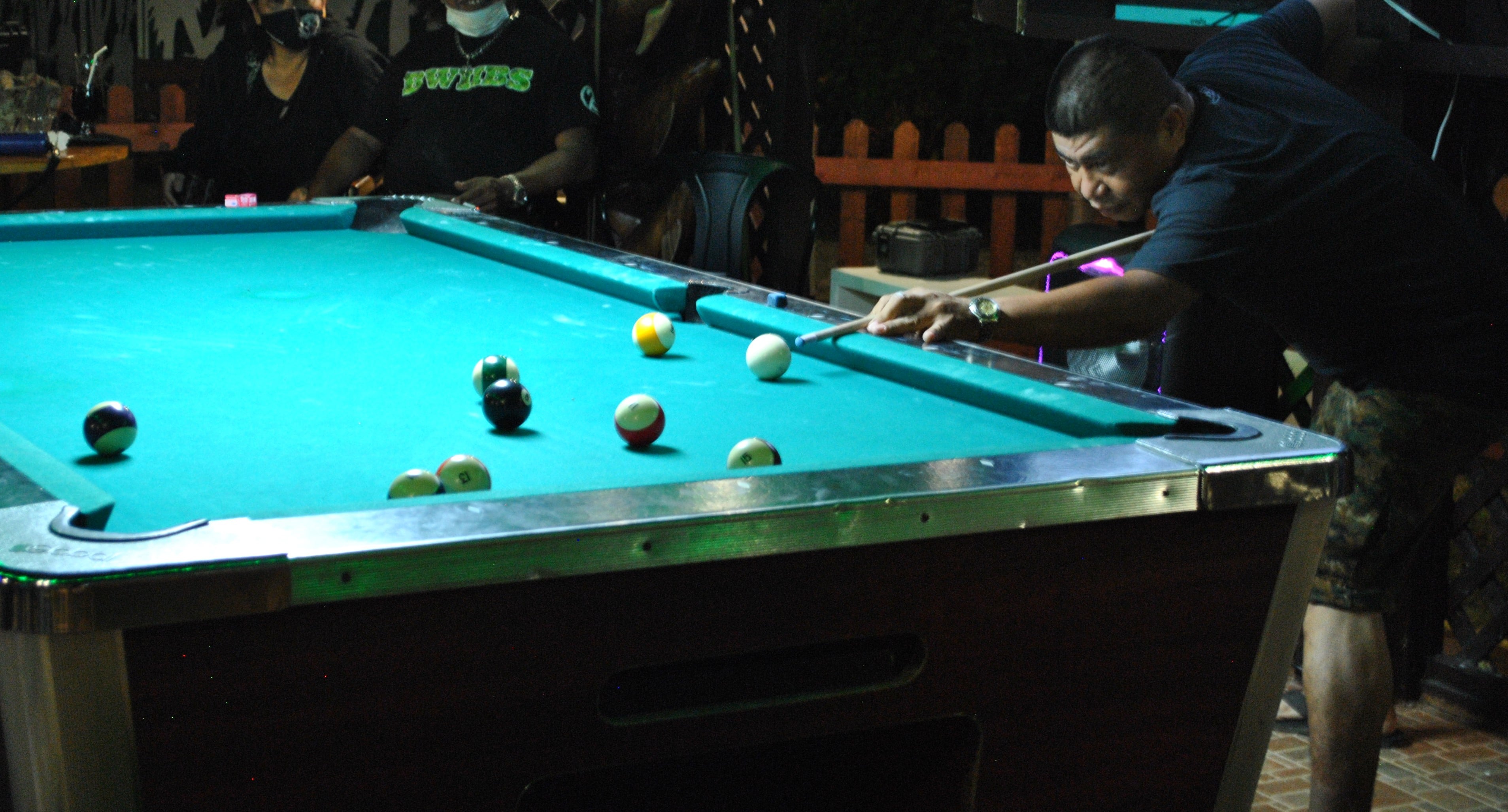 Jerry Soriano lines up for the shot during a pool tournament at the New Bamboo Bar of Saipan Vegas.Photo by James F. Sablan Jr.