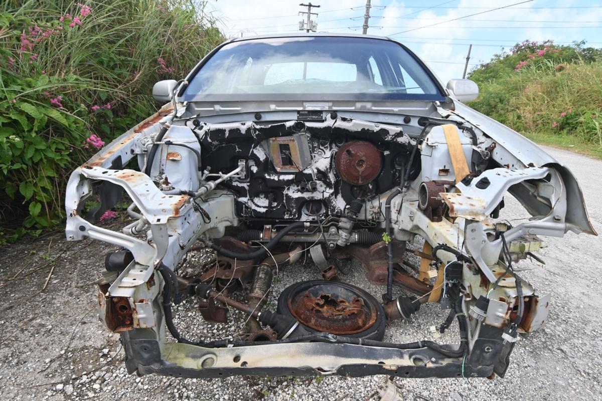An abandoned Chevy sedan has been stripped and left on the side of a road in Tamuning, Guam.Photo by David Castro/The Guam Daily Post