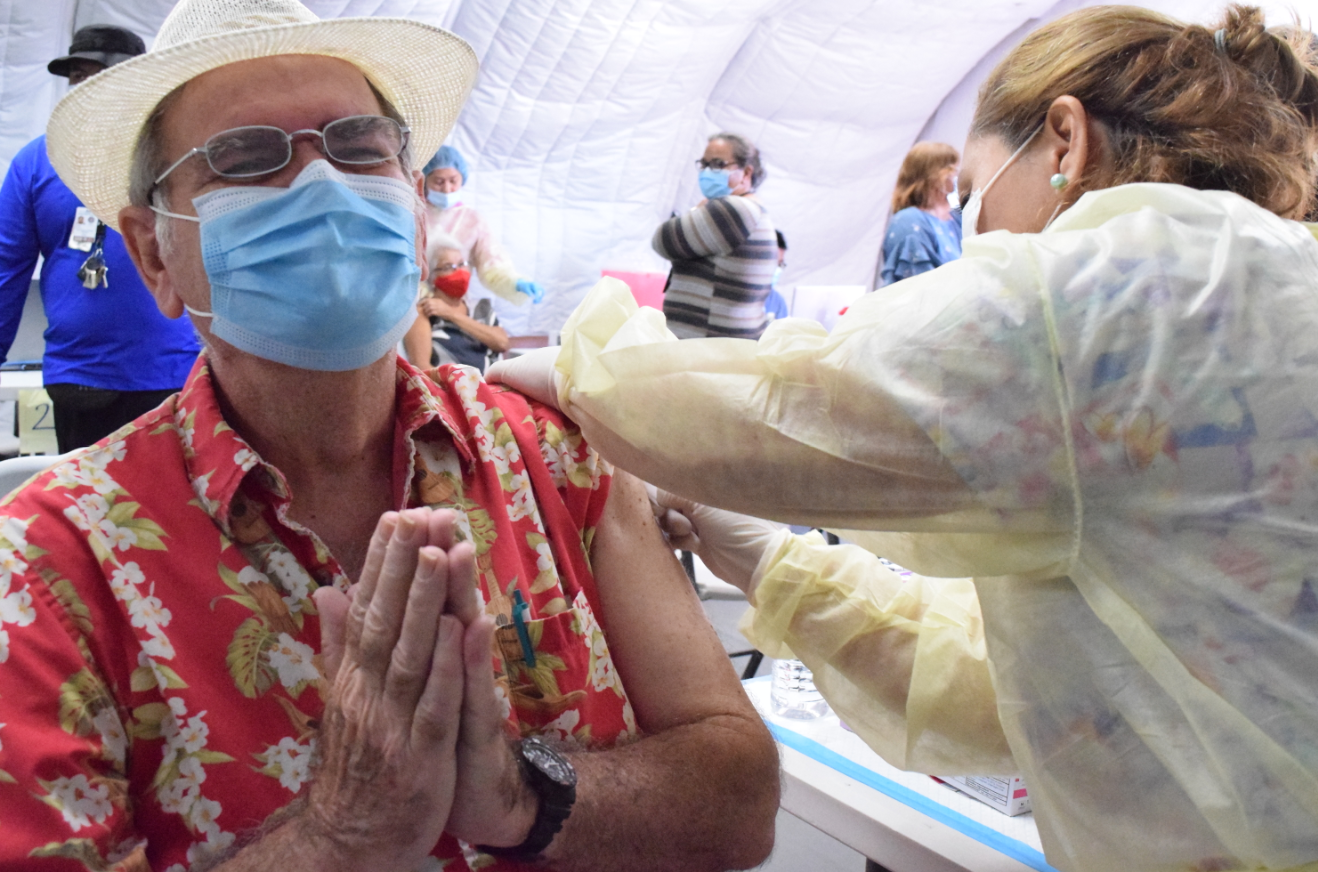 Laurina Boyer of the    Commonwealth Healthcare Corp. administers the second shot of Covid-19 vaccine to Jack Angello at the CHCC Medical Care and Treatment Site on Wednesday.Photo by Emmanuel T. Erediano