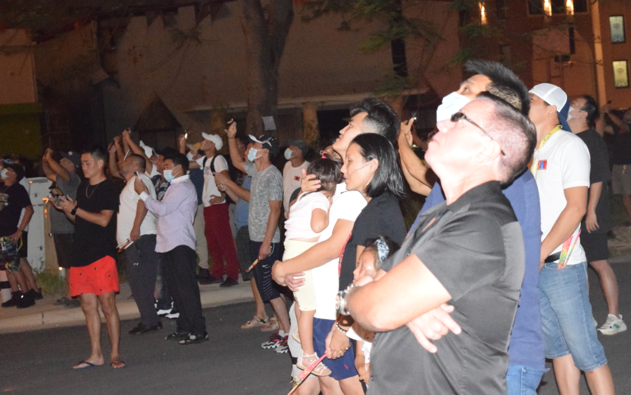 Imperial Pacific International chief executive officer Donnie Browne, right, joins the crowd watching the New Year fireworks display at the IPI hotel-casino  in Garapan on Sunday evening.Photo by Emmanuel T. Erediano