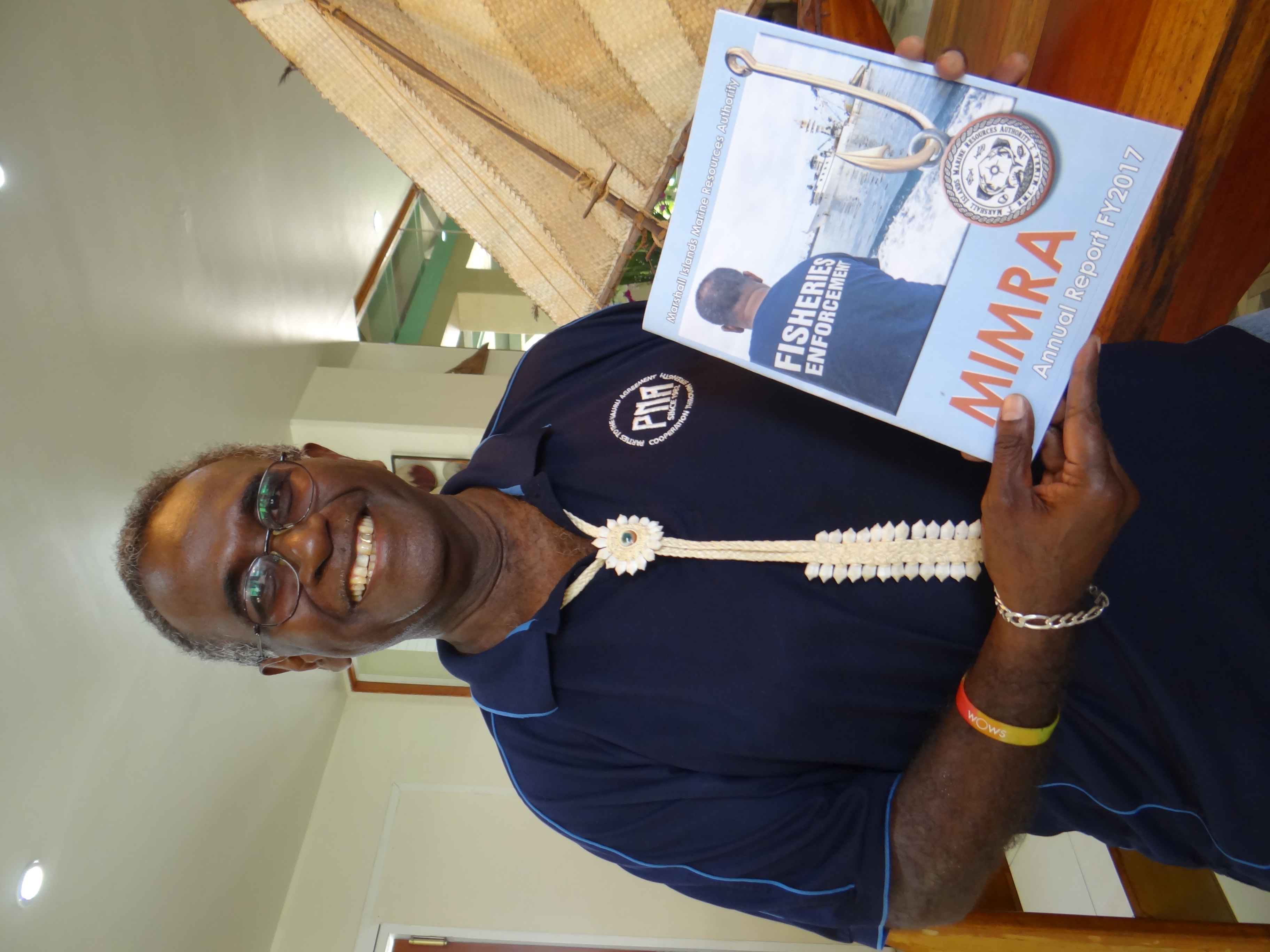 In this 2018 file photo, Dr. Transform Aqorau holds the Marshall Islands Marine Resources Authority's annual report. for FY 2017. Marshall Islands Journal photo