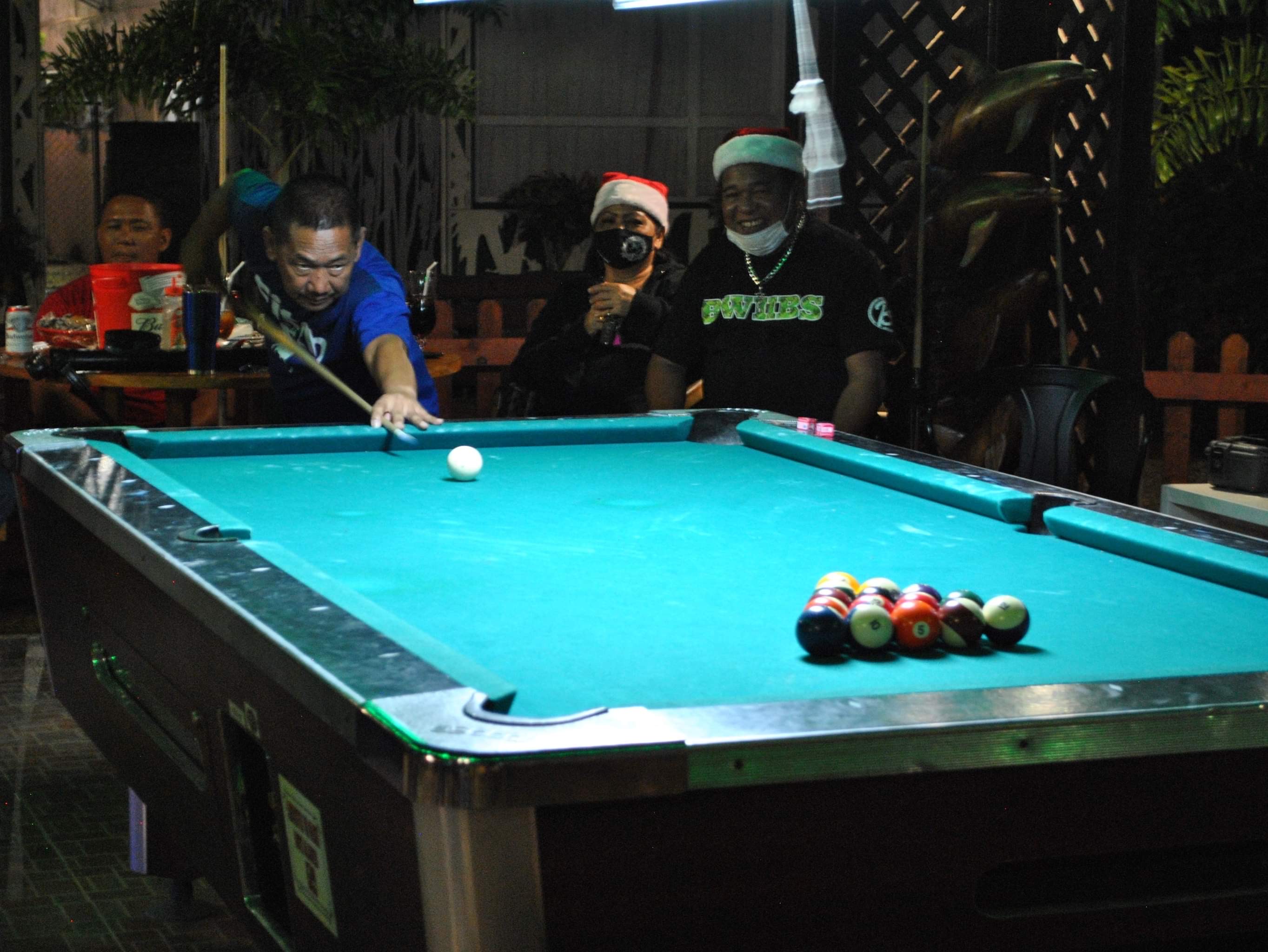 Senen Pangilinan lines up for the break during a pool tournament at the New Bamboo Bar of Saipan Vegas.Photo by James F. Sablan Jr.