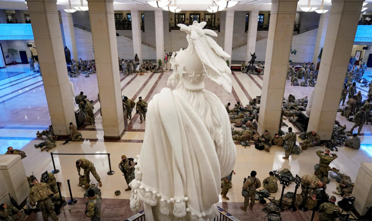 National Guard members assemble in the Capitol Visitor Center on Capitol Hill before Democrats begin debating one article of impeachment against President Donald Trump at the U.S. Capitol, in Washington, D.C. on Jan. 13, 2021.REUTERS