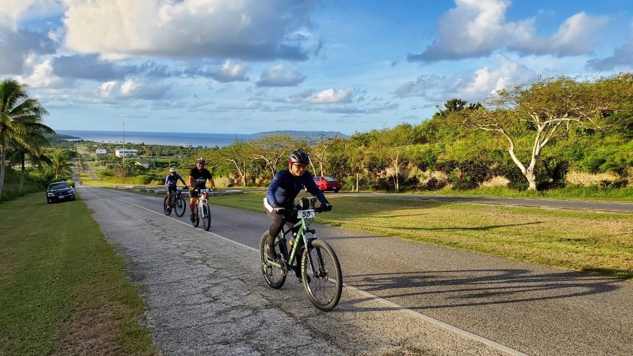 Participants in the 50K Pika Bike Race traverse Broadway on Feb. 13, 2021 at the 17th Annual Tinian Hot Pepper Festival.MVA photo