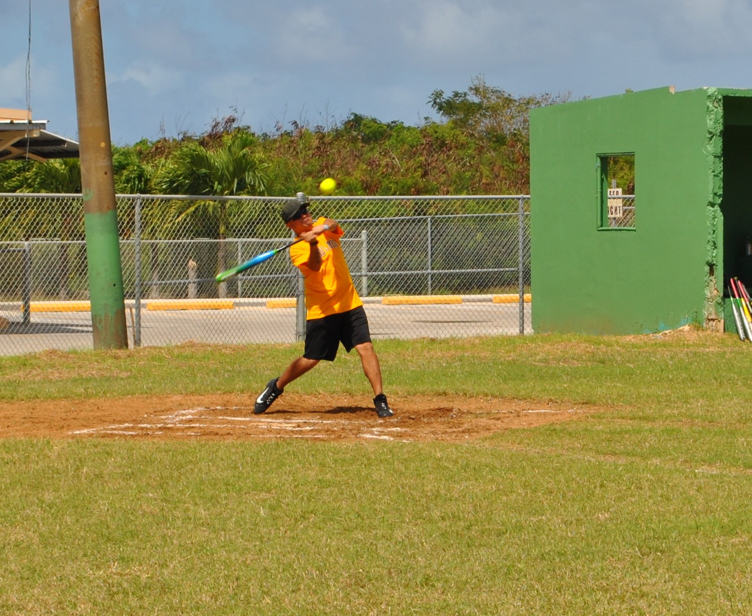 Hagu Lamun's Rodney connects at bat during a Belau Amateur Softball League game at the Dandan baseball field on Sunday. Photo by James F. Sablan Jr.