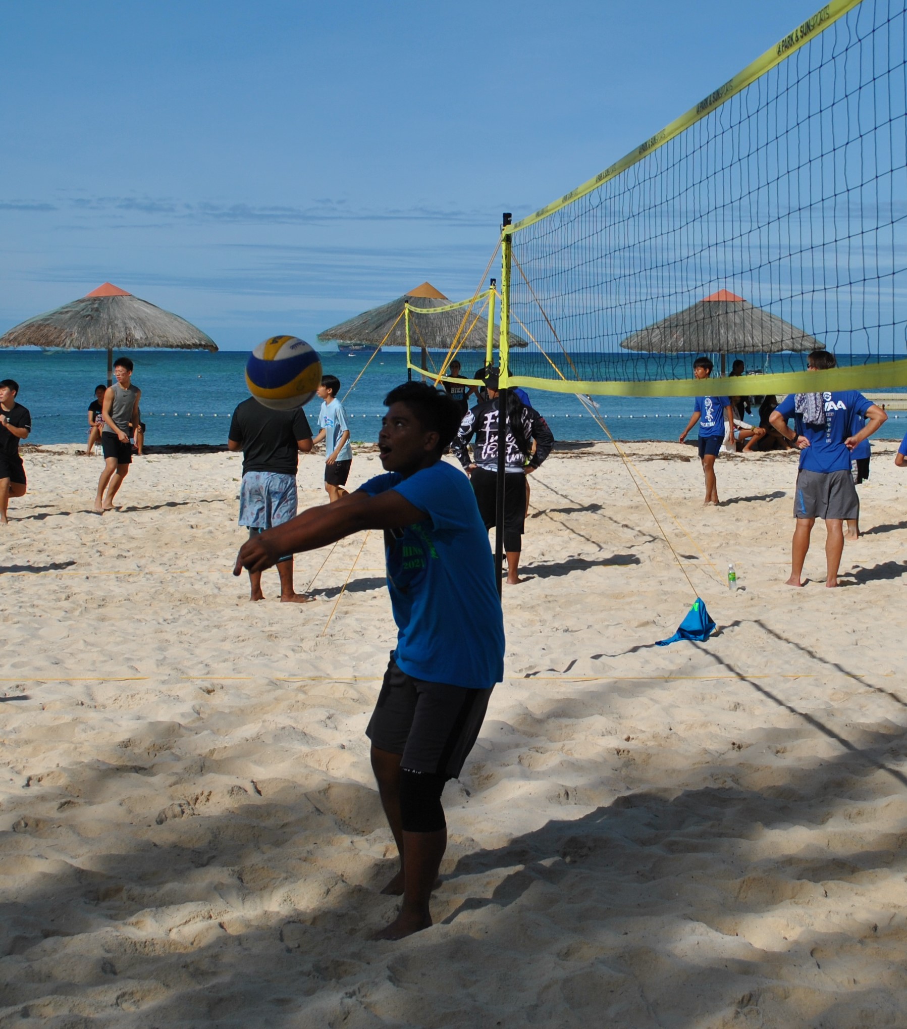 MHS 1's Nilo Calimag sets up the ball during a PSS 4v4 Beach Volleyball League boys division game at the Fiesta Resort & Spa beach on Saturday.Photo by James F. Sablan Jr.