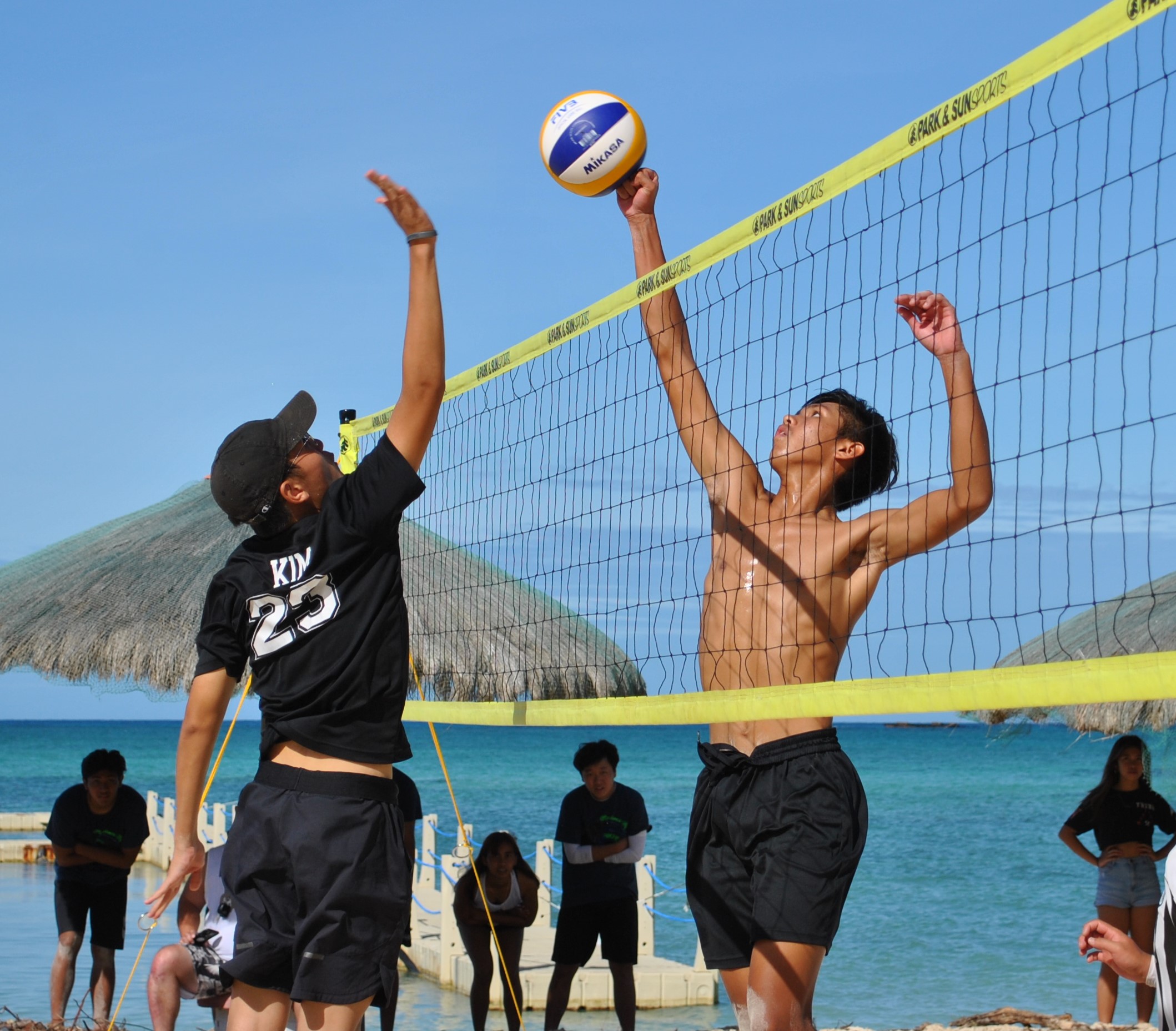 Mount Carmel School 1's Merrick Toves rises for the spike finish  during a PSS Boys 4v4 Beach Volleyball League game at the Fiesta Resort & Spa beach on Saturday.Photo by James F. Sablan Jr.