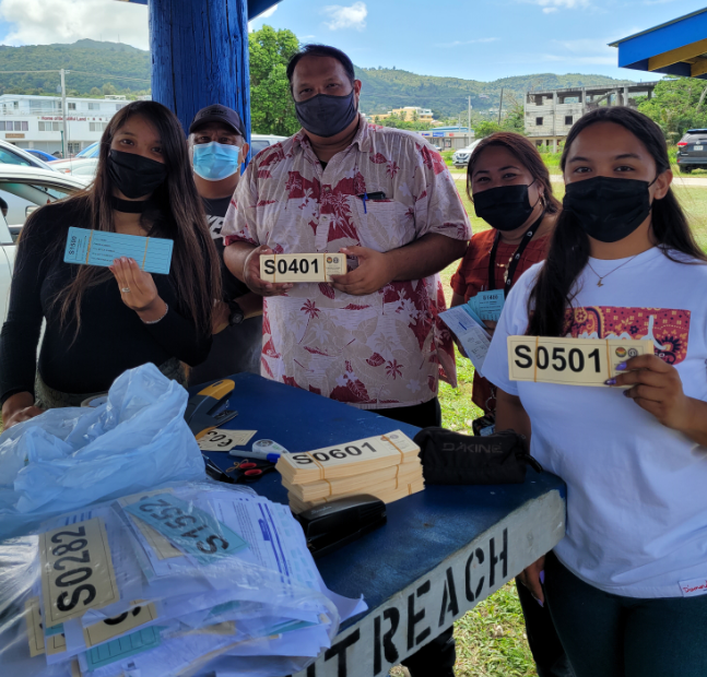 CNMI Office of Grants Management & State Clearinghouse Administrator Epi Cabrera and staffers show the tickets given to households who registered for the Covid-19 food packages on Thursday.Photo by Bryan Manabat
