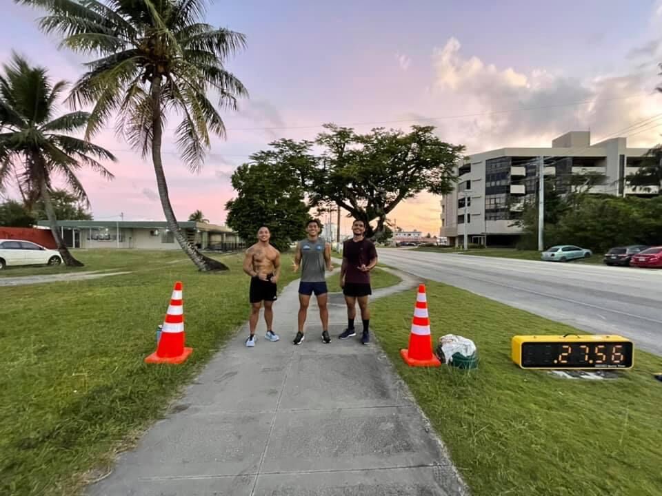 Gerald Galang, left, Christopher Aninzo, center, and Gerald De Guzman pose for a photo after completing Saturday's Run Saipan Underground 5K Race at the Beach Road pathway.Contributed photo