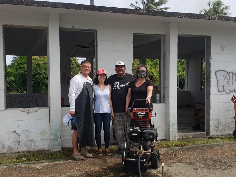 From left, the chairman of the governor’s economic council of advisers, Jerry Tan, Rep. Tina Sablan, Rep. John Paul Sablan, and Sen. Edith Deleon Guerrero pose for a photo at the Susupe basketball court and social hall on Saturday.Photo courtesy of Rep. Tina Sablan