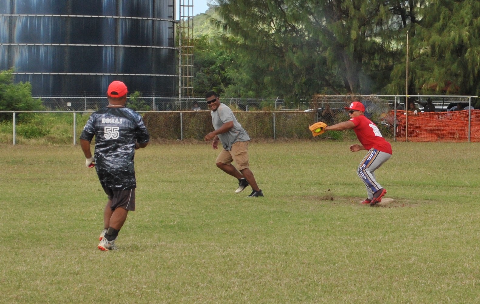Man Amigos' Pete Sablan secures the out at second base and attempts to throw to third for the double-play during a Belau Amateur Softball League game Sunday at the Dandan baseball field.Photo by James F. Sablan Jr.