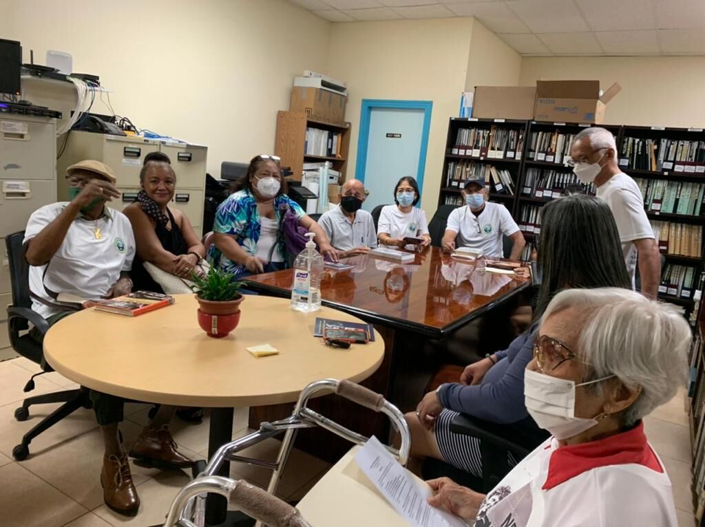 Local author Marie Castro, right foreground, and other members of the Amelia Earhart Memorial Monument Inc. at the Historic Preservation Office.Contributed photo