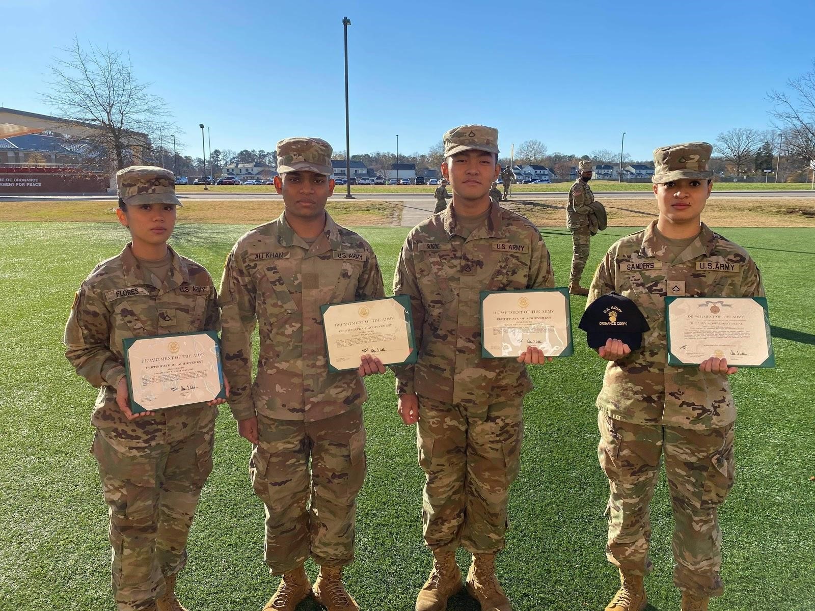 Pvt. 1st Class Keyla B. Flores, left, with fellow soldiers.Contributed photo