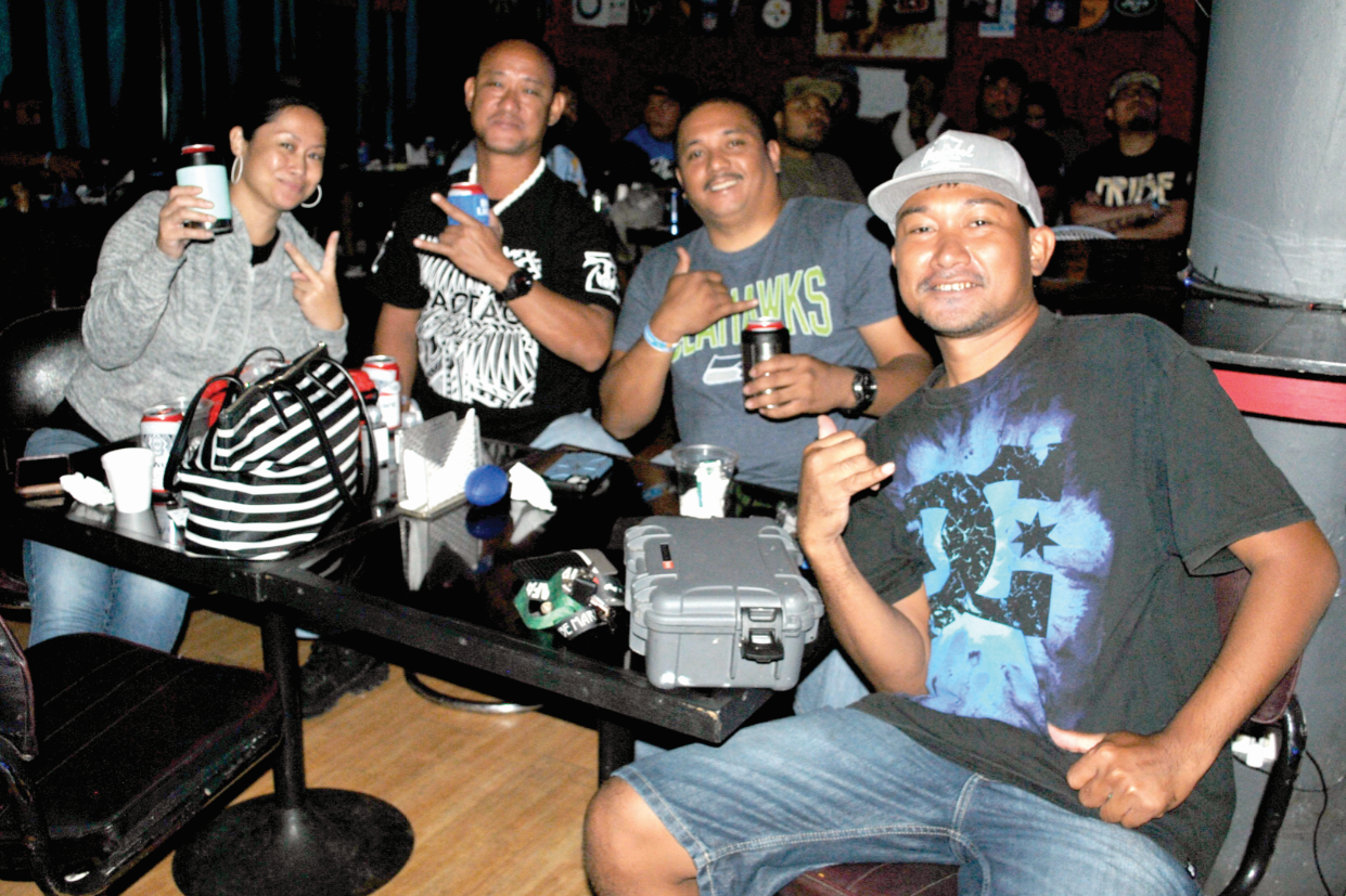 Football fans smile for Variety  at the 9Eleven Restobar where they watched Super Bowl LV on Monday morning.Photo James F. Sablan Jr.