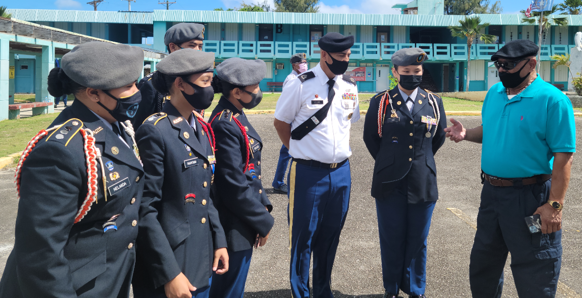 Board of Education Vice Chairman Herman Atalig, right, speaks to the Dolphin Battalion cadets and instructor.Photo by K-Andrea Evarose S. Limol