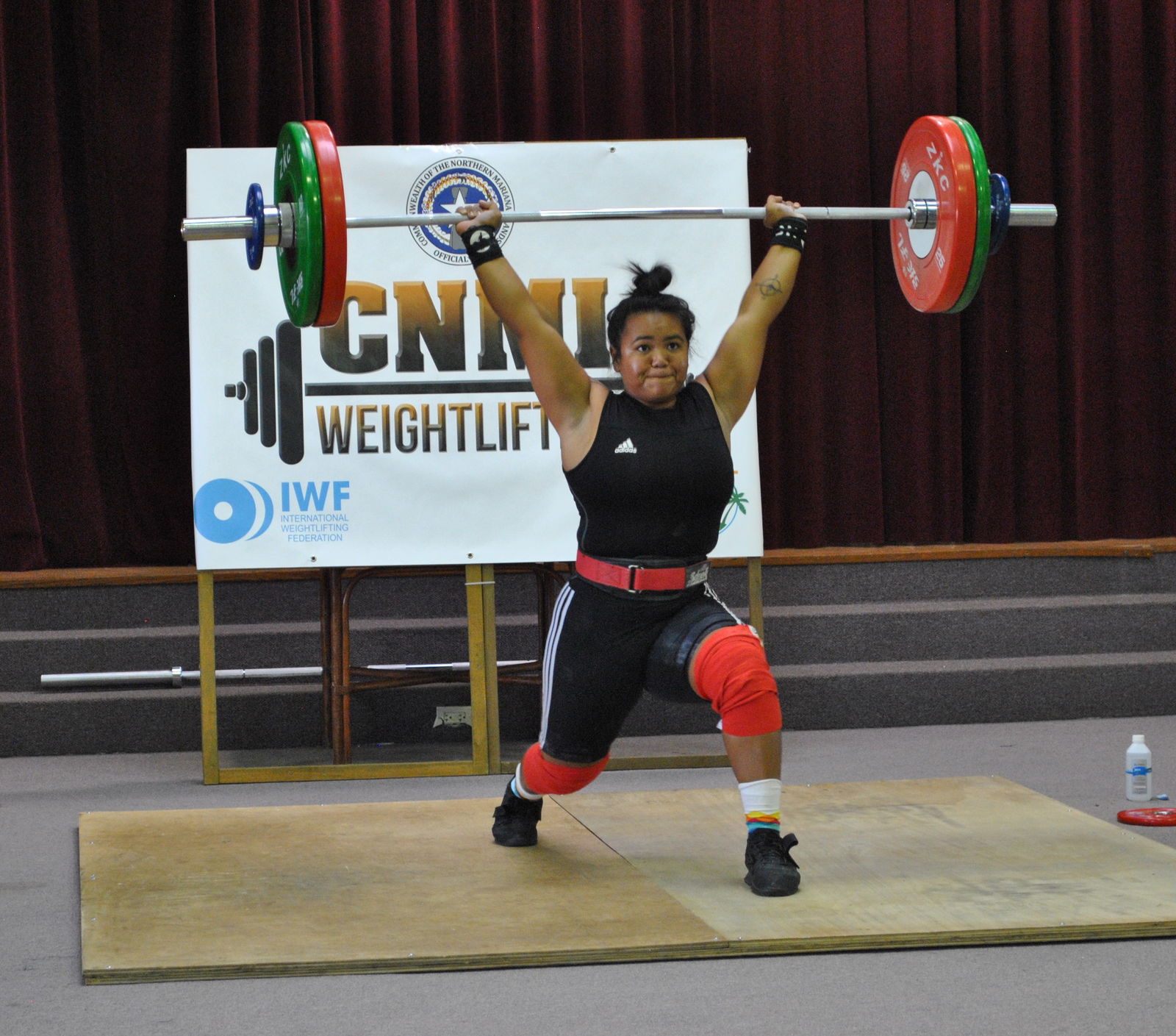 Antonette Labausa makes a transition in the 94k clean & jerk competition of the 2nd Marianas Cup on Saturday at the multi-purpose center.Photo by James F. Sablan Jr.