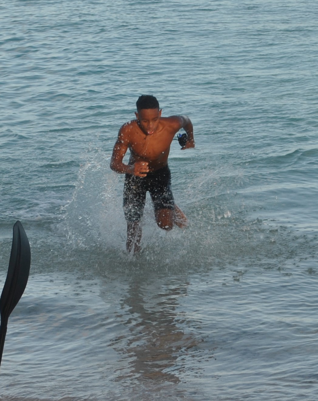 February Male Student Athlete of the Month Isaiah Aleksenko makes his way out of the water during the 6th Aquathon  on Feb. 27, 2021 at  Paupau Beach.Photo by James F. Sablan Jr.