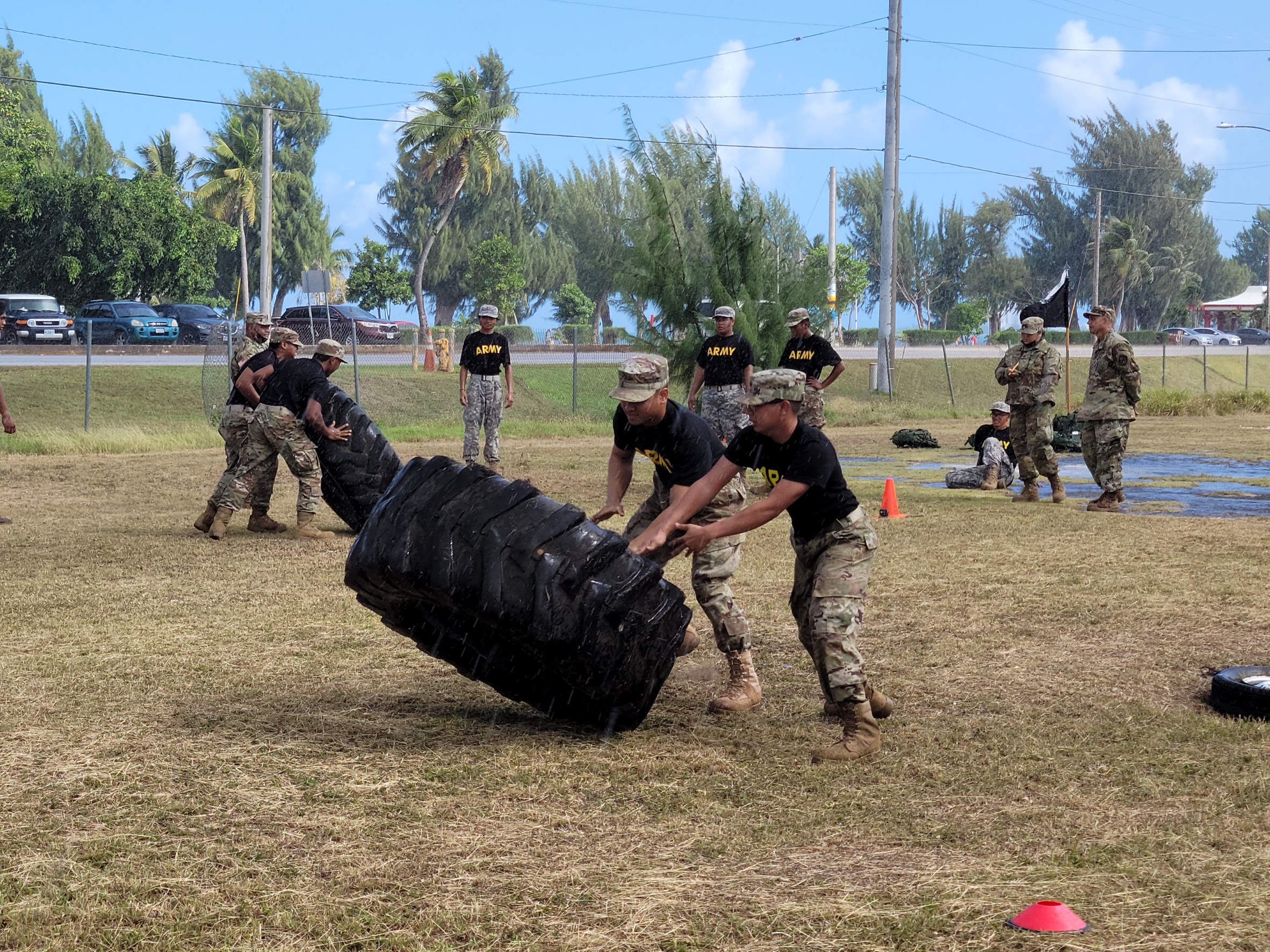 NMC SROTC cadets lift a tire under the pouring rain during the relay race.Photo by K-Andrea Evarose S. Limol