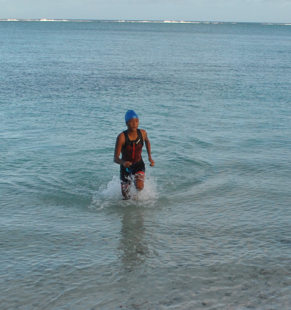 Andrei Kaithlyn Chavez completes the 1km swim of the 6th Aquathon at Paupau Beach on Saturday.Photo by James F. Sablan Jr
