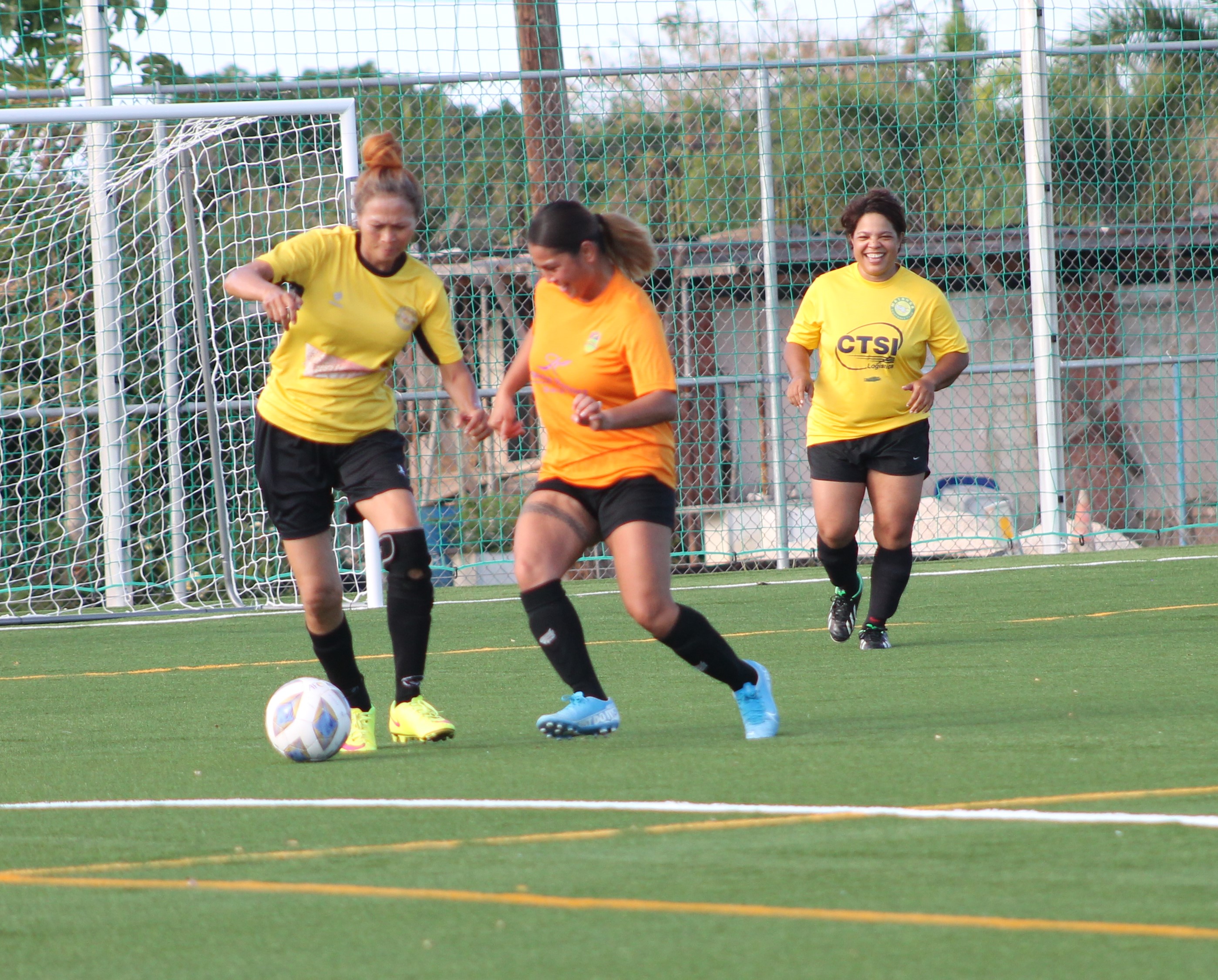Matansa’s Wasana Gregory tries to control the possession as a Kanoa defender closes in during a Dove Women's League Spring 2021 Masters Division game Sunday at the NMI Soccer Training Center’s mini-pitch.Photo by James F. Sablan Jr